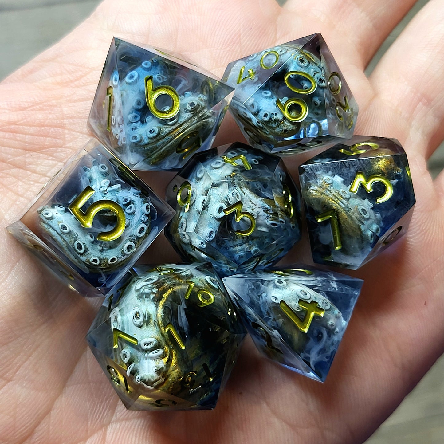 Resin dice set with octopus tentacles inside, gold numbers, perfect for Dungeons and Dragons, Call of Cthulhu, and tabletop RPG games