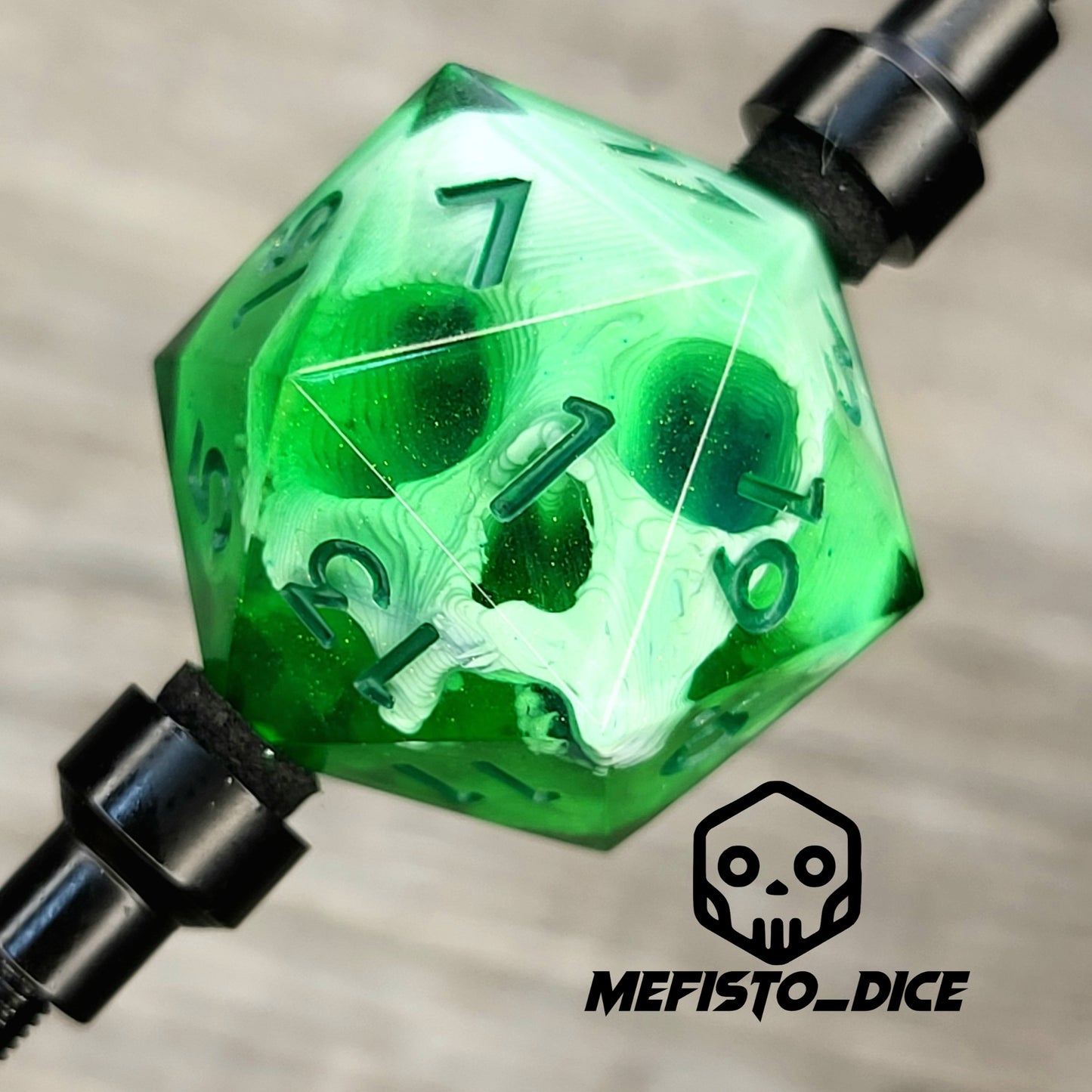 This is a single set of one D20 DnD die with a white skull inside, green resin and green numbers for role playing games