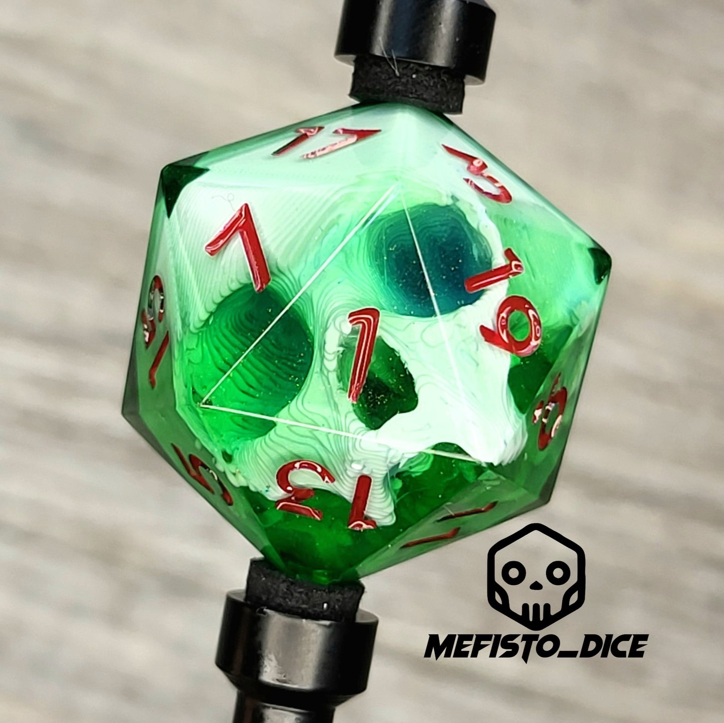 D20 single die with a white skull inside, red numbers, green resin for role playing games, DnD, dungeons and dragons, board games