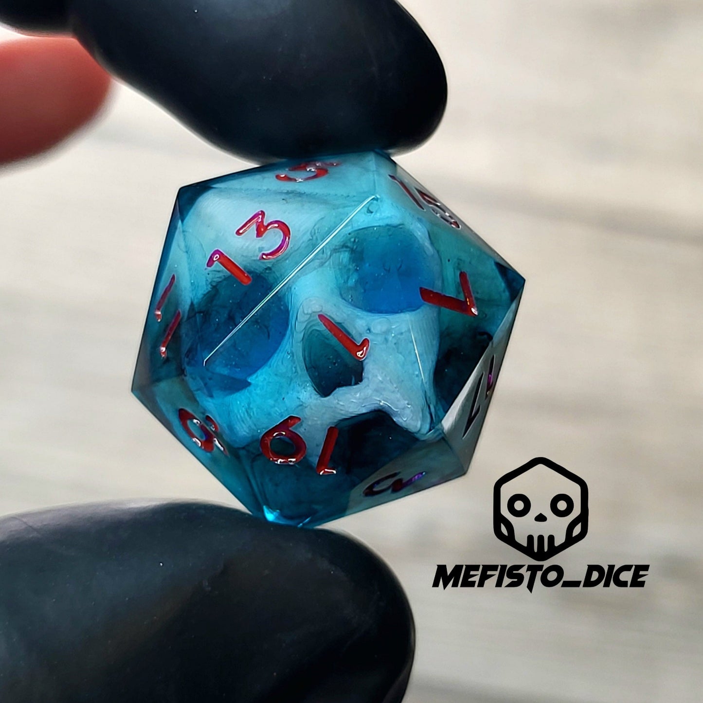 This is a single set of one D20 DnD die with a white fluo skull inside , dark resin and red numbers