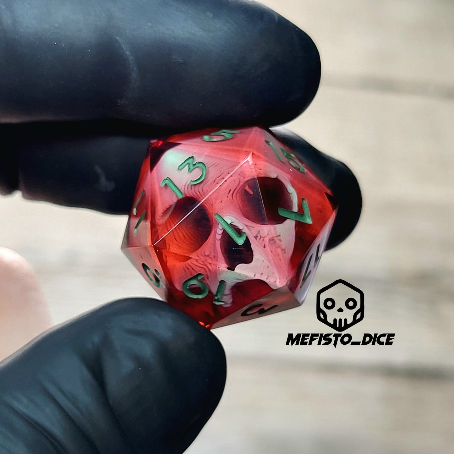 This is a single set of one D20 DnD die with a light green skull inside , red resin and green numbers
