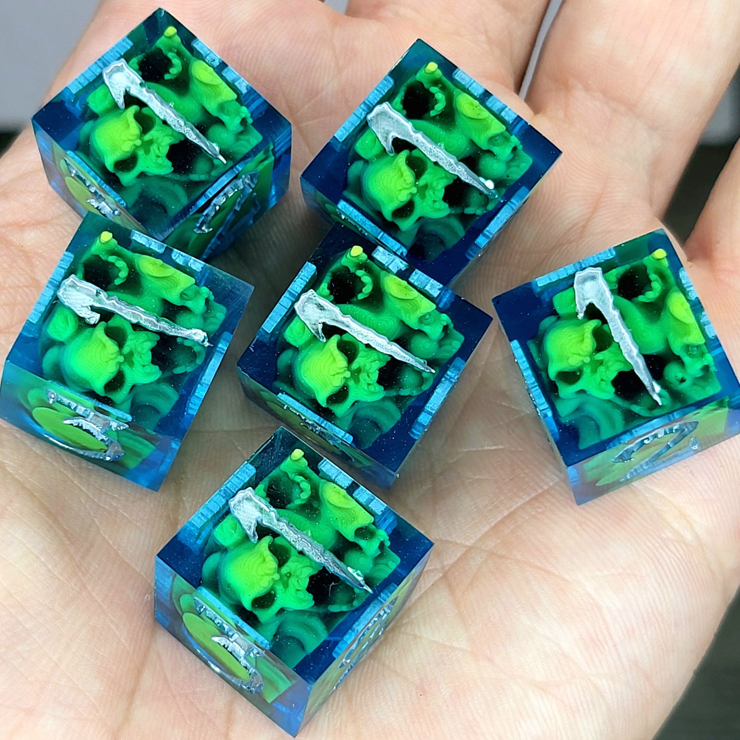 D6 dice set with mini skulls inside, blue resin details, gothic style for Dungeons and Dragons and tabletop role-playing games