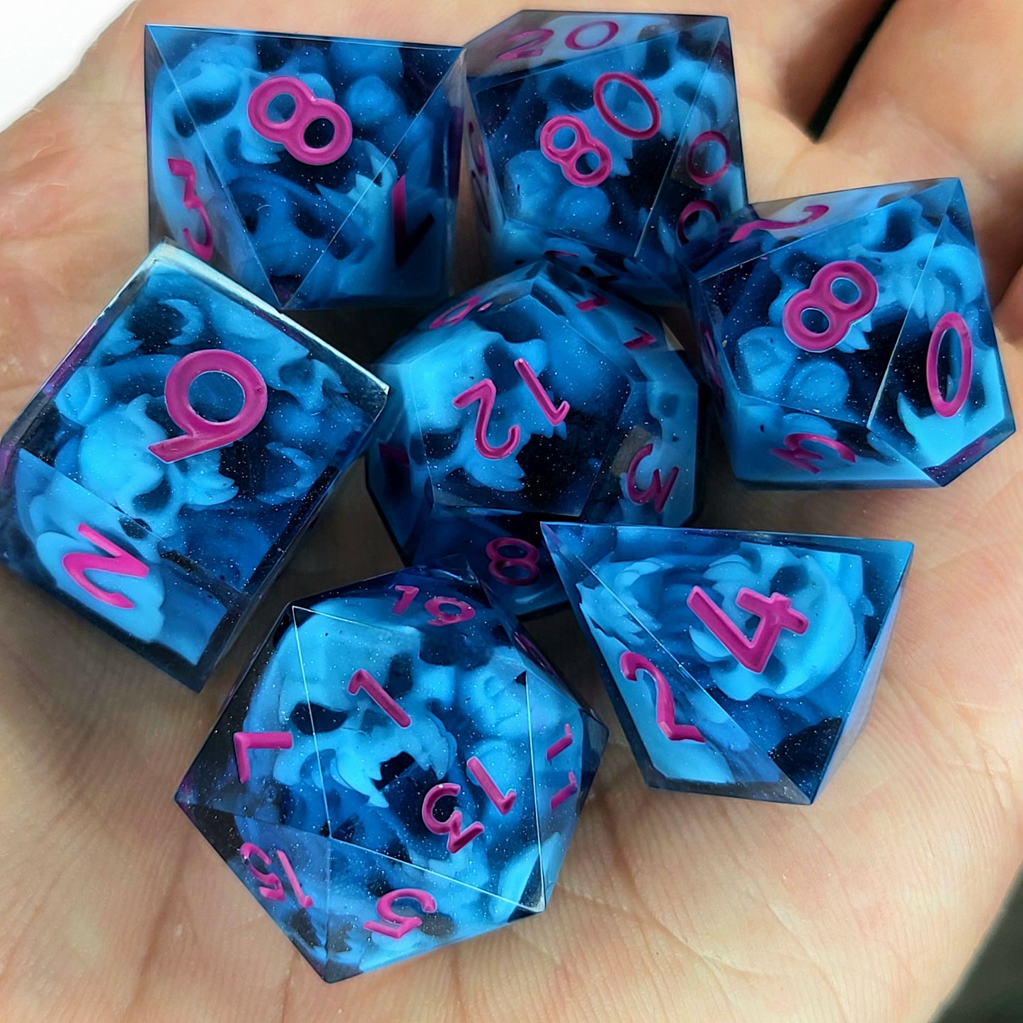 Dice set with blue spirit inside and magenta numbers for play dnd , dungeons and dragons