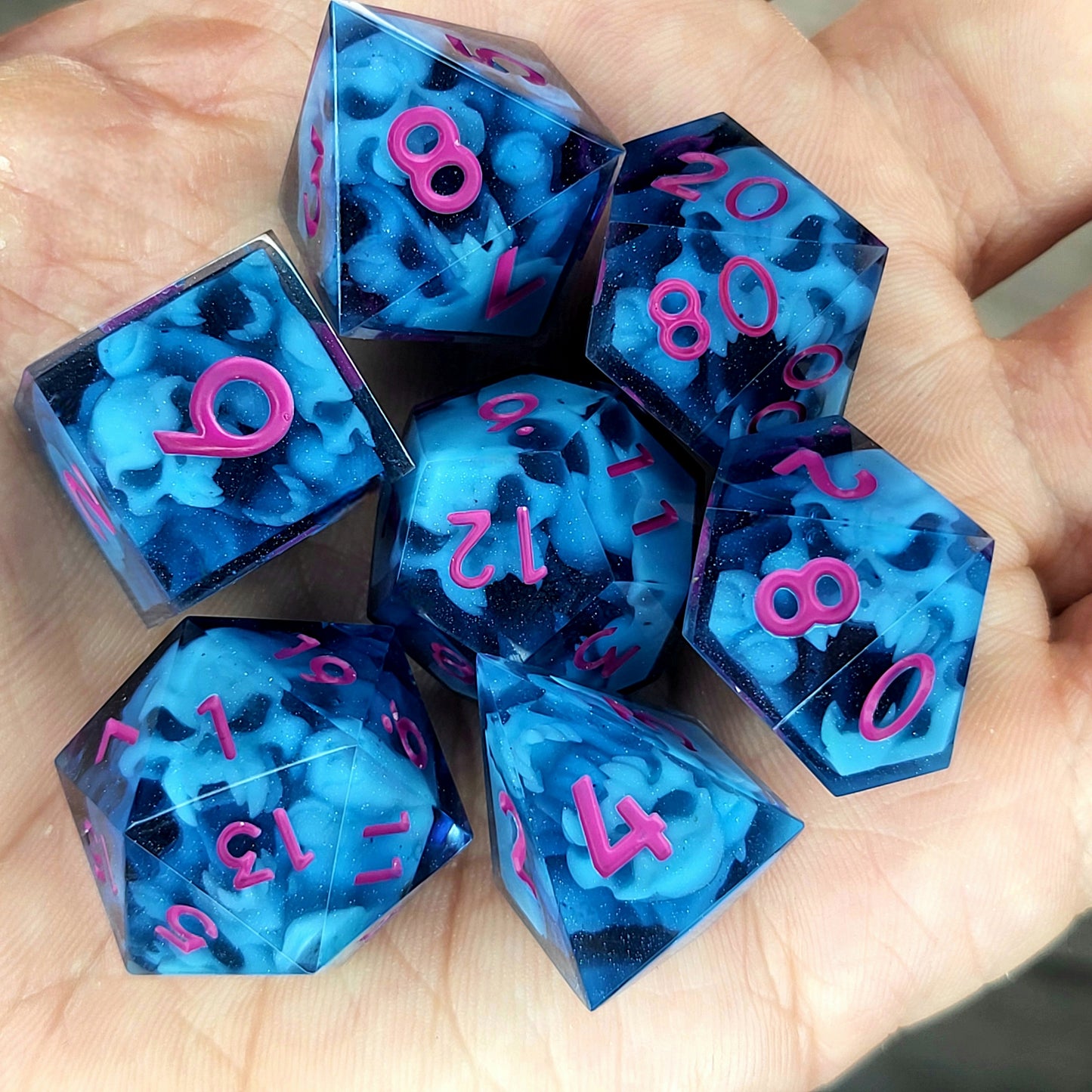 Dice set with blue spirit inside and magenta numbers for play dnd , dungeons and dragons