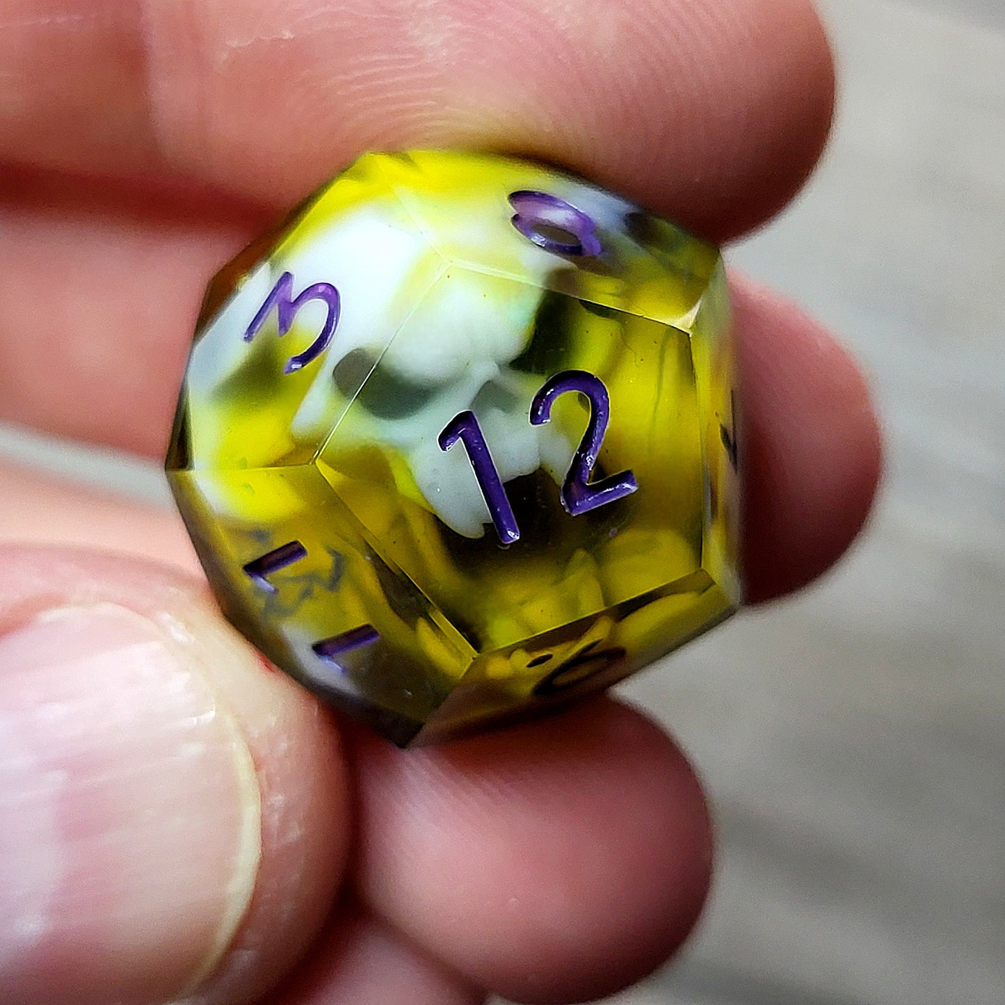 DnD dice yellow and purple ink spirit skull