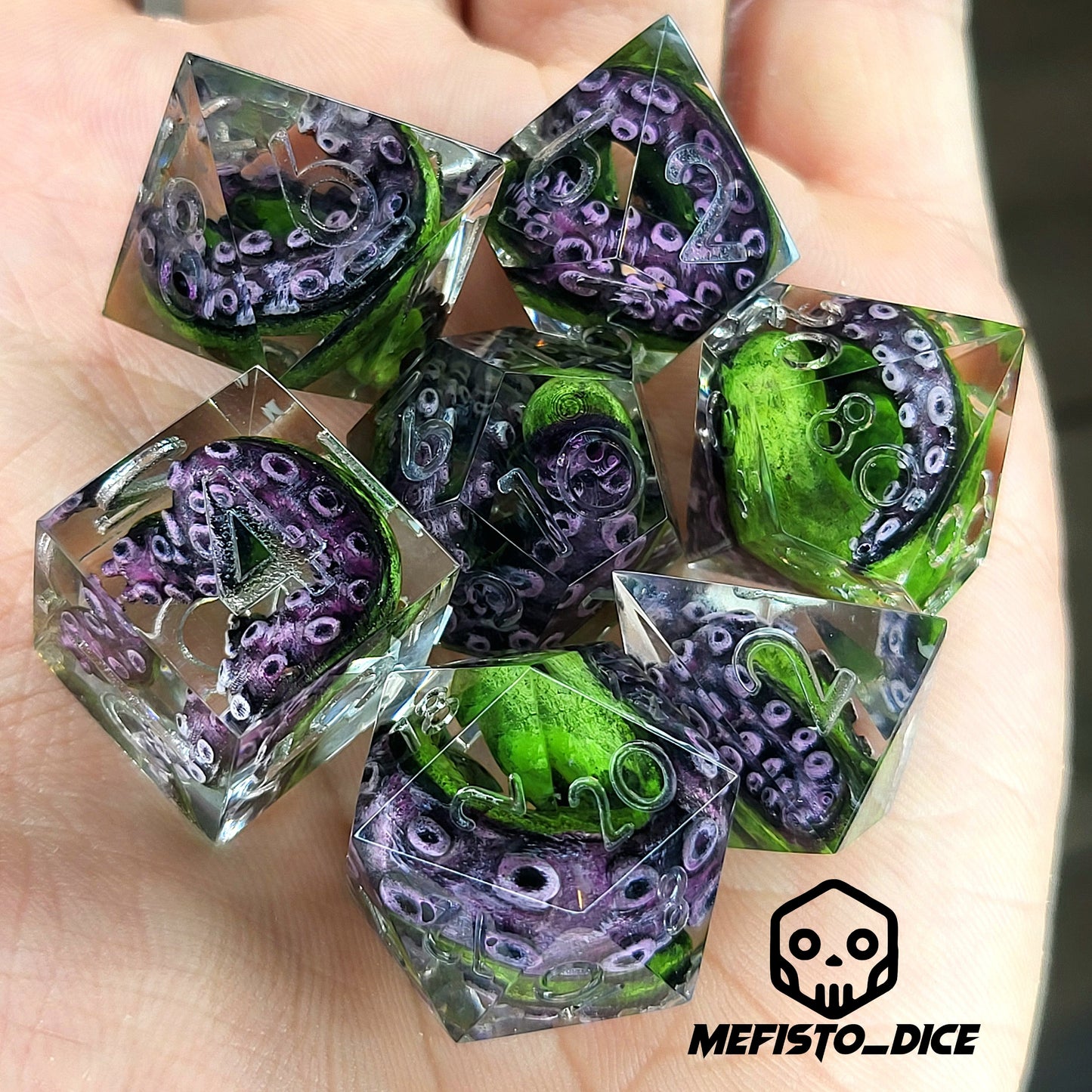 Dice set with green tentacles inside for role playing games, dungeons and dragons, board games