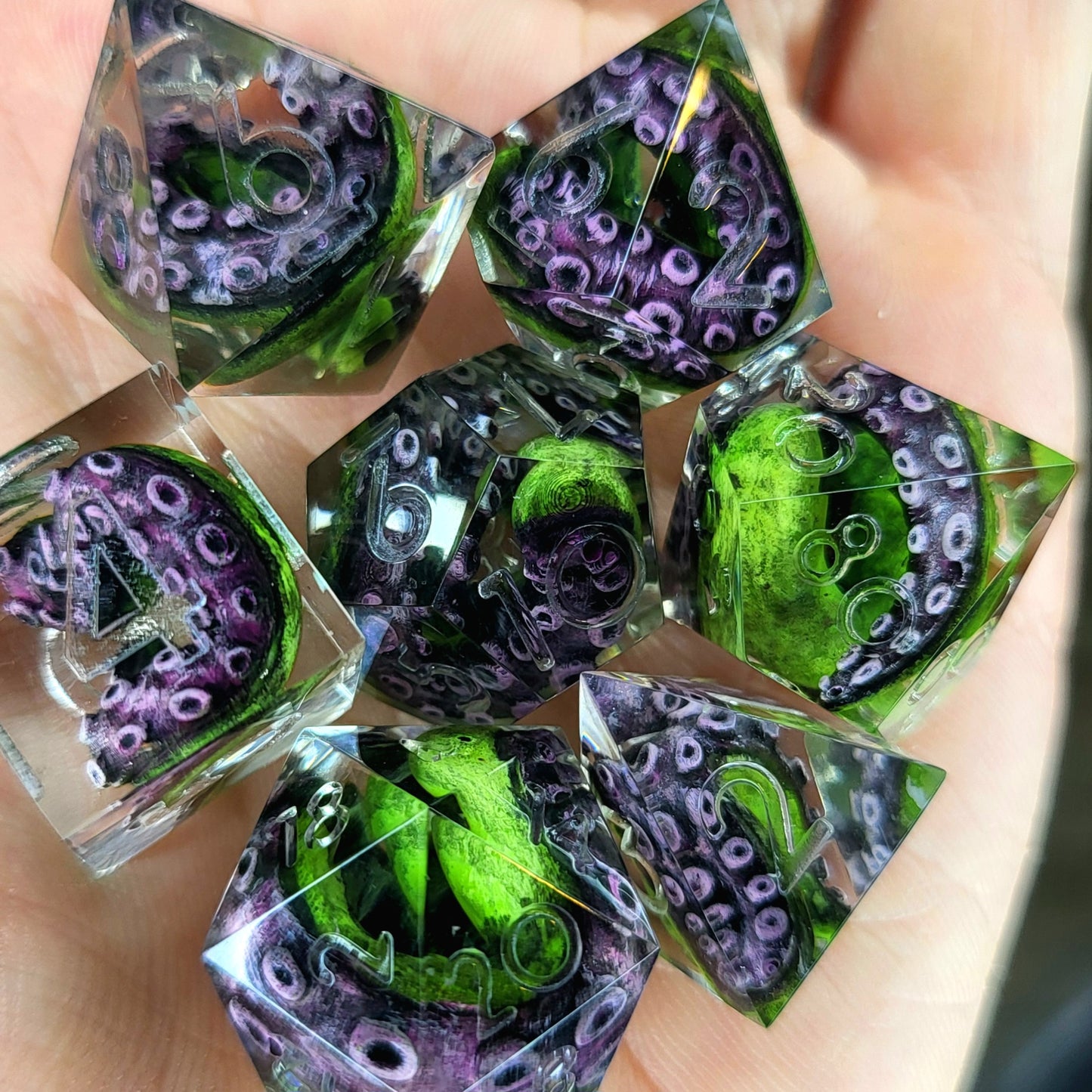 Dice set with green tentacles inside for role playing games, dungeons and dragons, board games