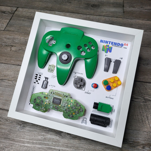 Shadow Box 10x10 with wood frame and polycarbonate glass for wall and Tabletop containing a disassembled controller for Playstation and Nintendo