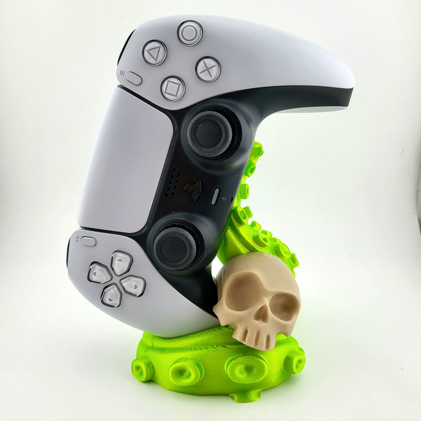 One ps5 controller stand featuring a skull design and green tentacle, 3D printed with high-quality PLA.