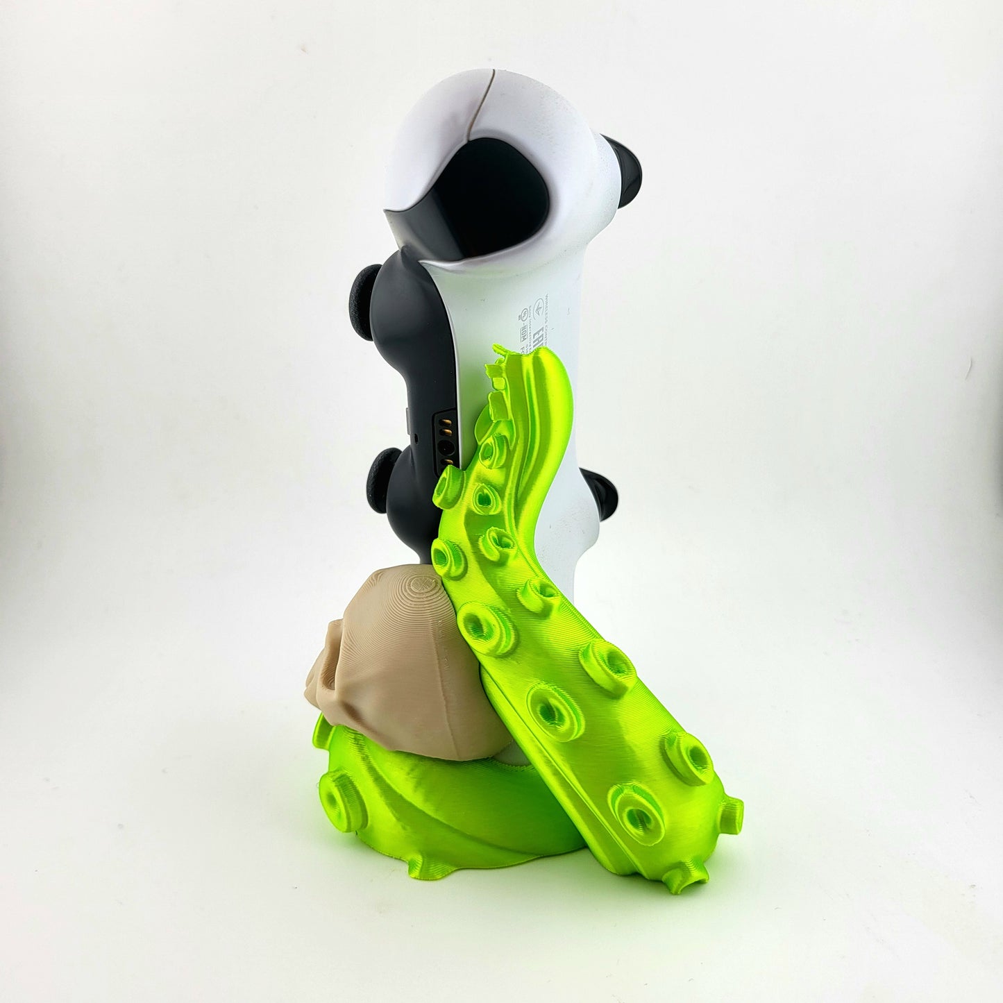 One ps5 controller stand featuring a skull design and green tentacle, 3D printed with high-quality PLA.