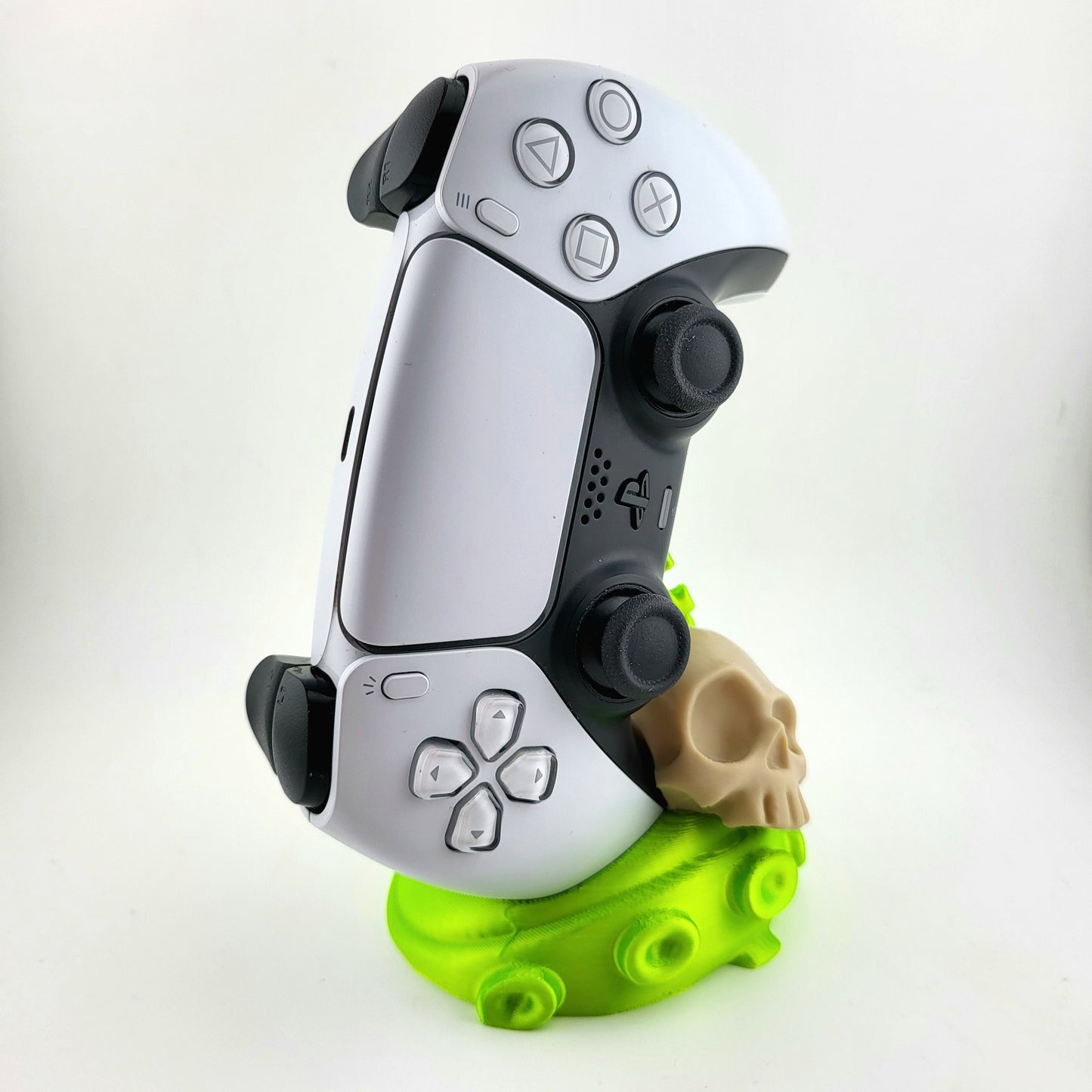 One ps5 controller stand featuring a skull design and green tentacle, 3D printed with high-quality PLA.