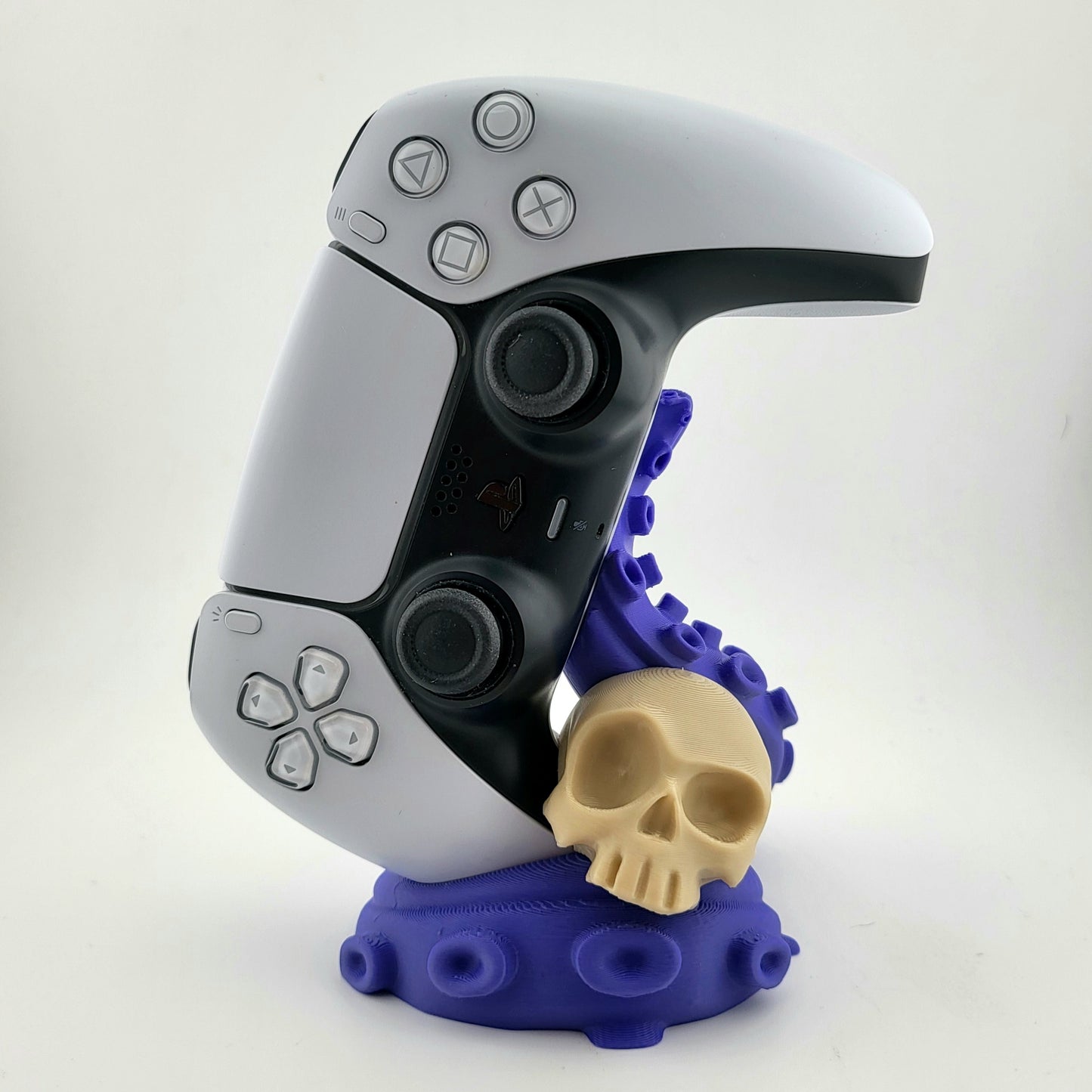 One PS5 controller stand featuring a skull design and purple tentacles, 3D printed with high-quality PLA.