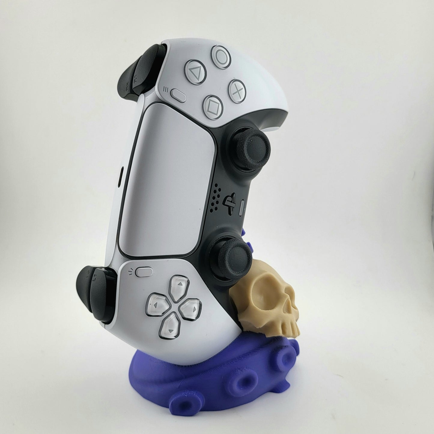 One PS5 controller stand featuring a skull design and purple tentacles, 3D printed with high-quality PLA.