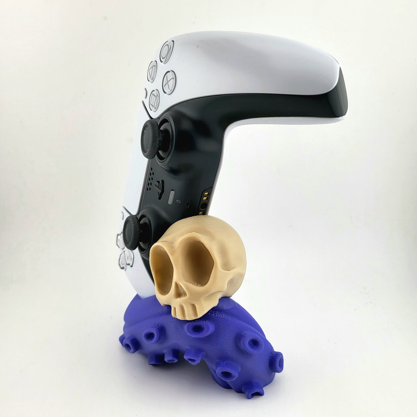 One PS5 controller stand featuring a skull design and purple tentacles, 3D printed with high-quality PLA.