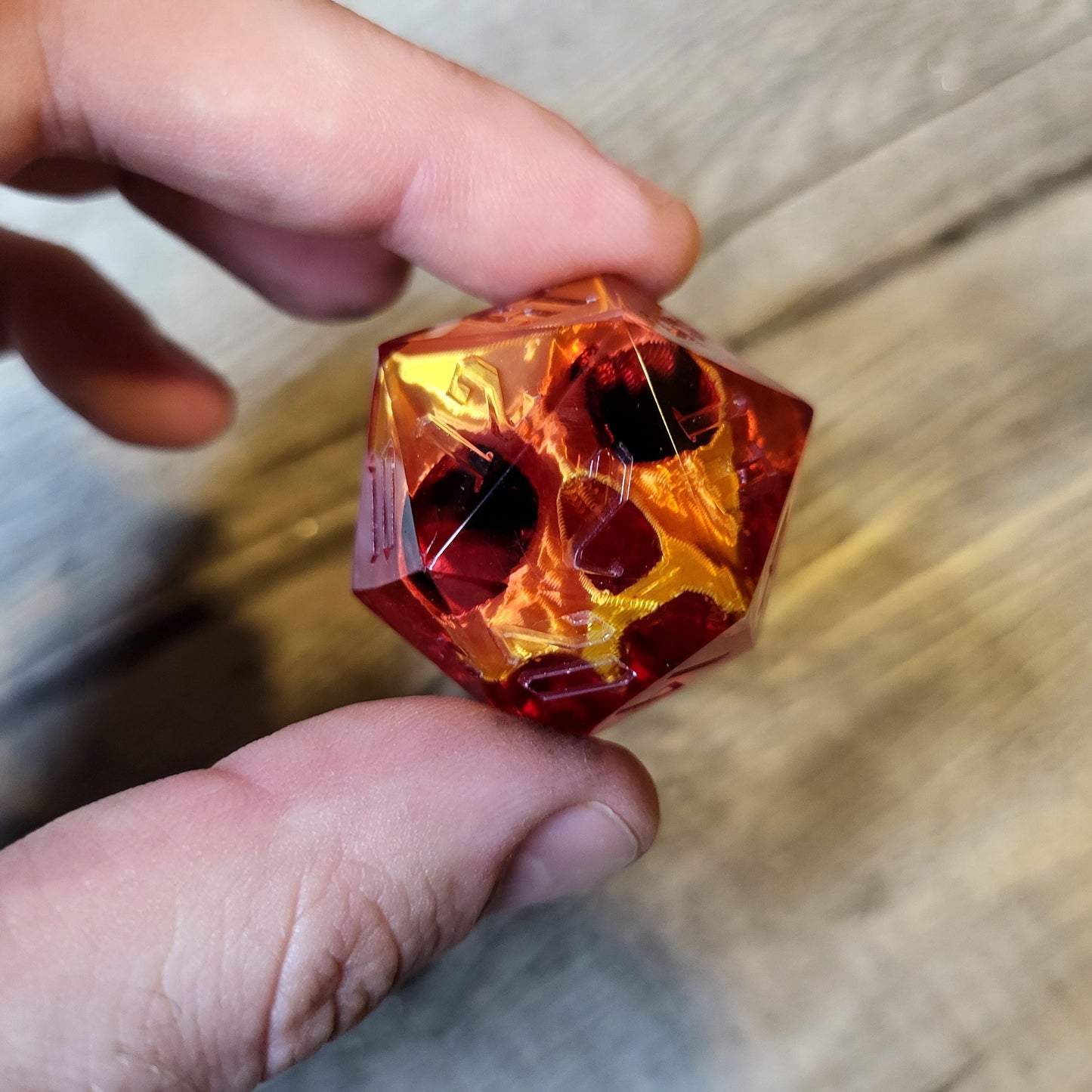 D20 dice in 33 mm format with skull inside for role-playing games for Dungeons and Dragons