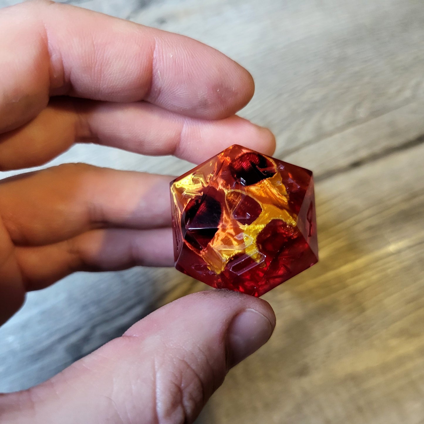 D20 dice in 33 mm format with skull inside for role-playing games for Dungeons and Dragons