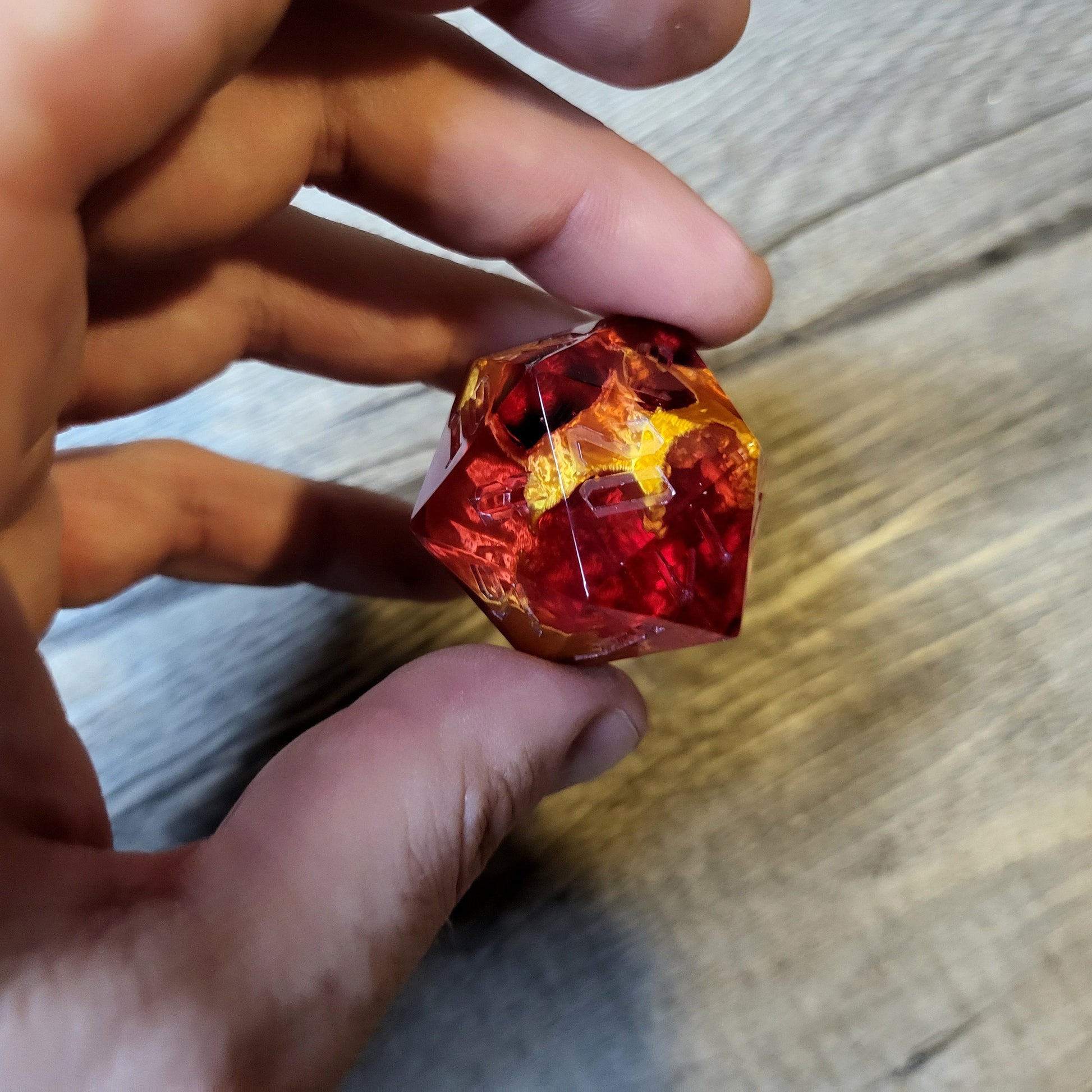 D20 dice in 33 mm format with skull inside for role-playing games for Dungeons and Dragons