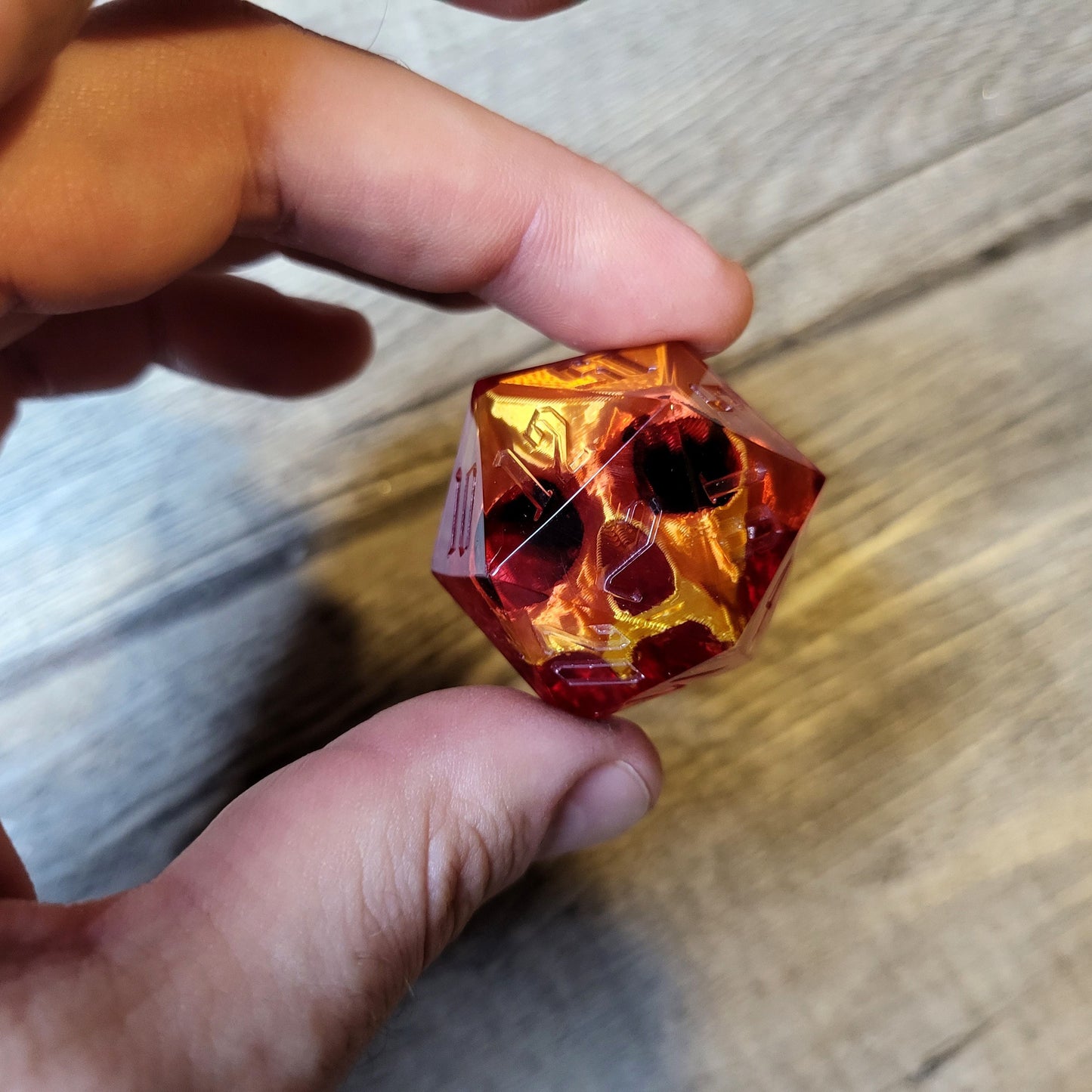 D20 dice in 33 mm format with skull inside for role-playing games for Dungeons and Dragons