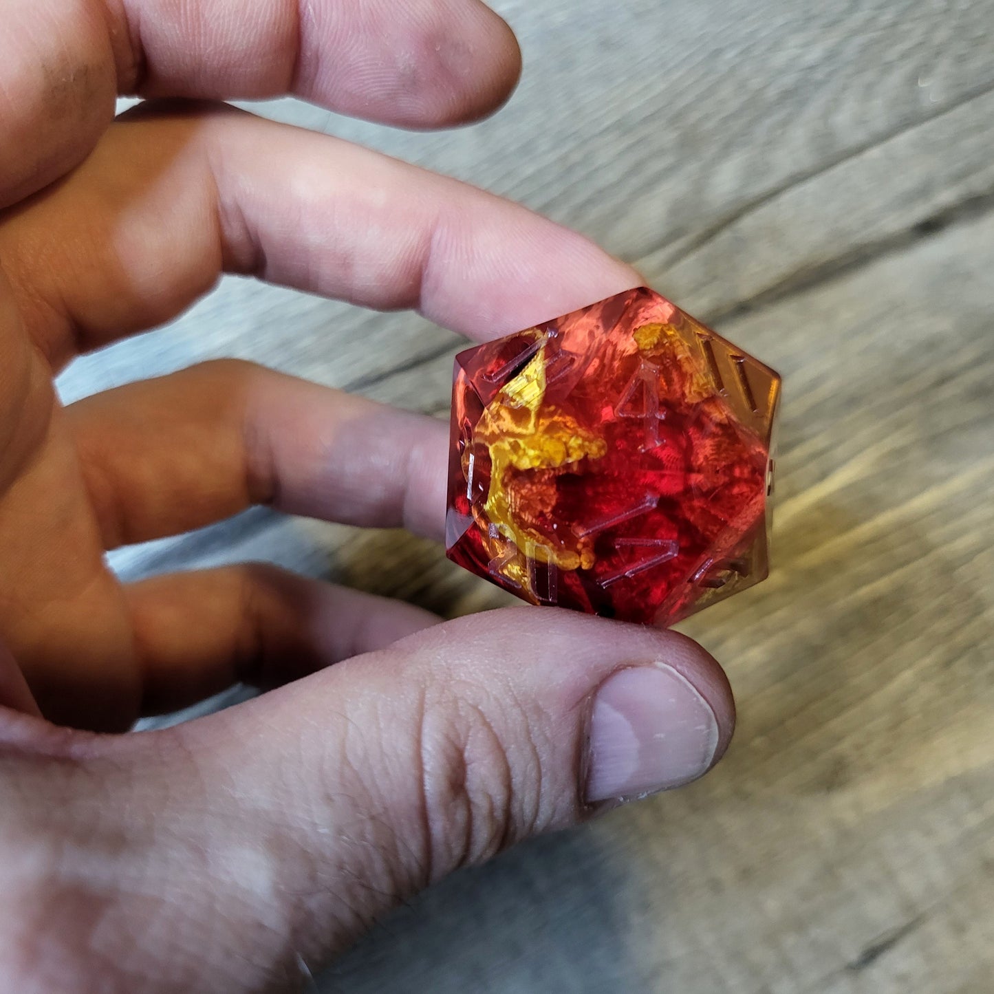 D20 dice in 33 mm format with skull inside for role-playing games for Dungeons and Dragons