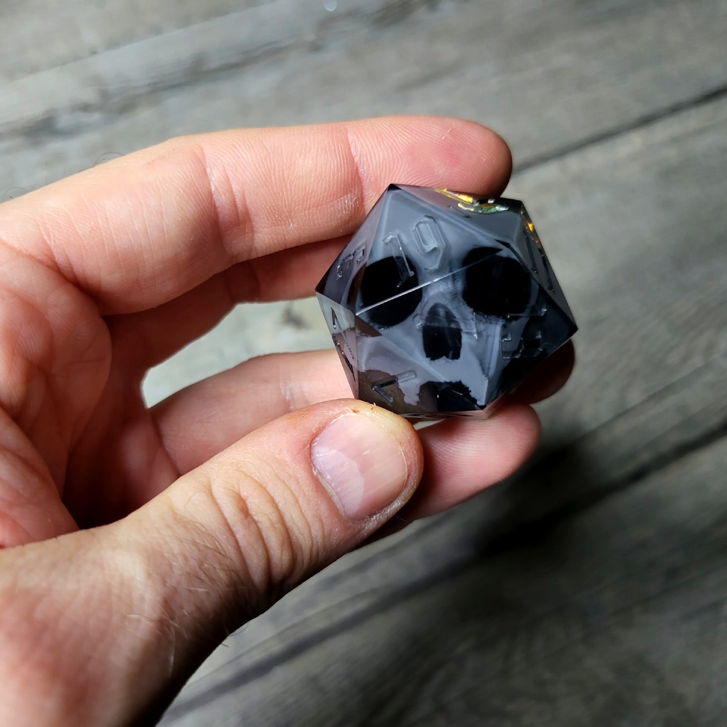 D20 dice in 33 mm format with skull inside for role-playing games for Dungeons and Dragons