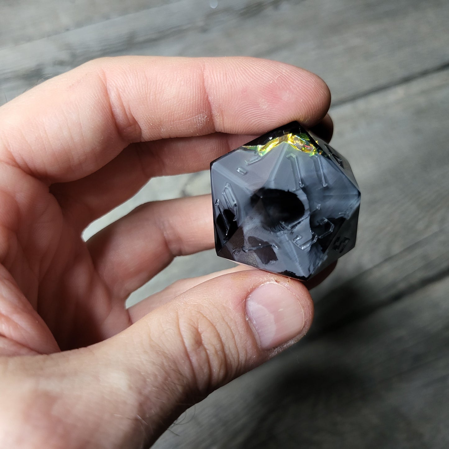 D20 dice in 33 mm format with skull inside for role-playing games for Dungeons and Dragons