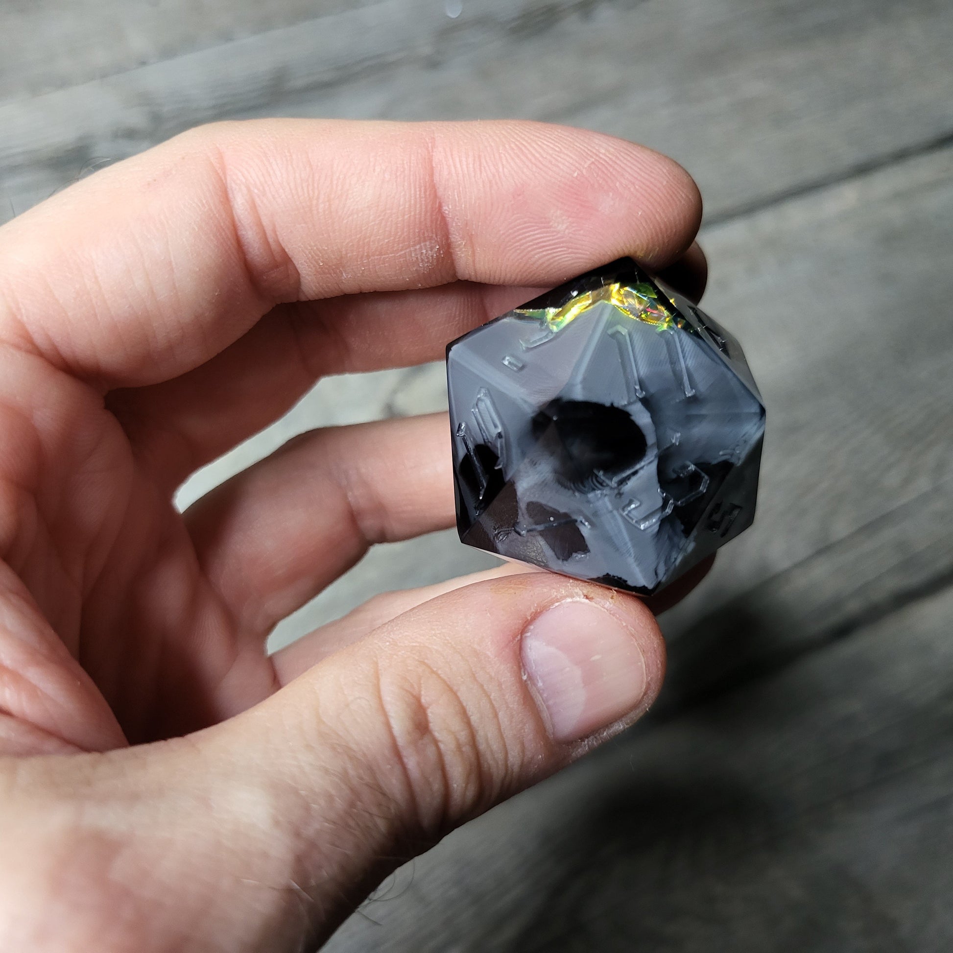D20 dice in 33 mm format with skull inside for role-playing games for Dungeons and Dragons