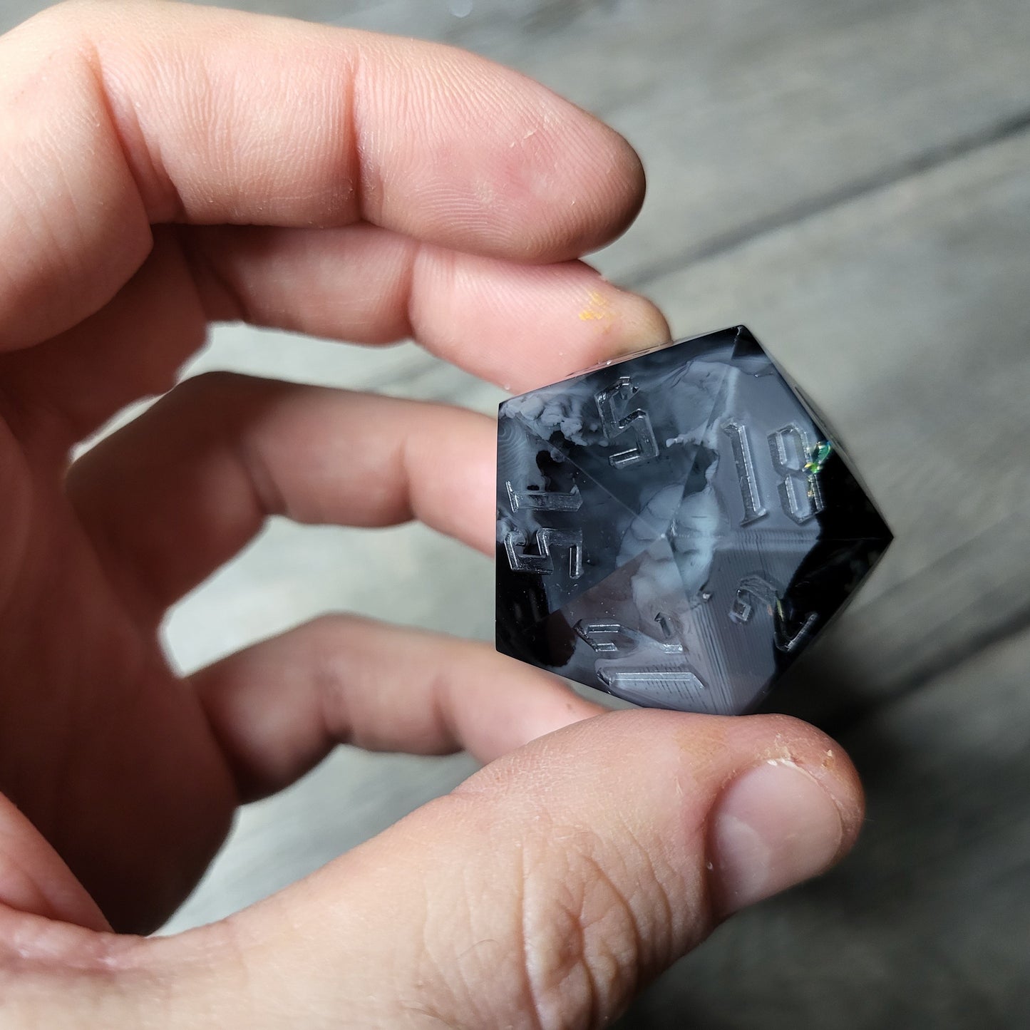 D20 dice in 33 mm format with skull inside for role-playing games for Dungeons and Dragons