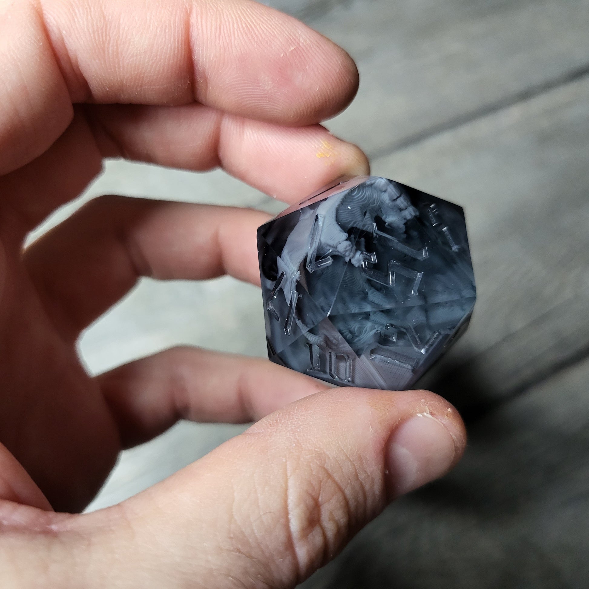 D20 dice in 33 mm format with skull inside for role-playing games for Dungeons and Dragons