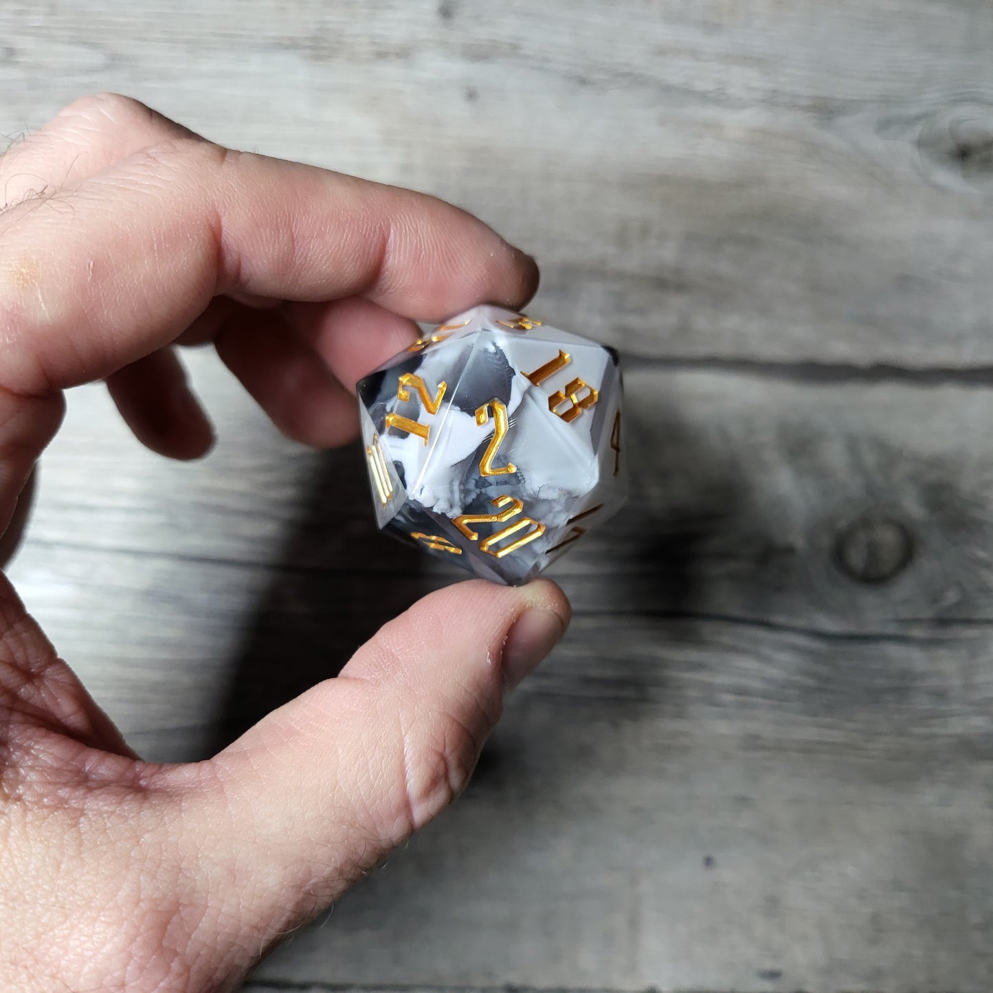 D20 dice in 33 mm format with skull inside for role-playing games for Dungeons and Dragons