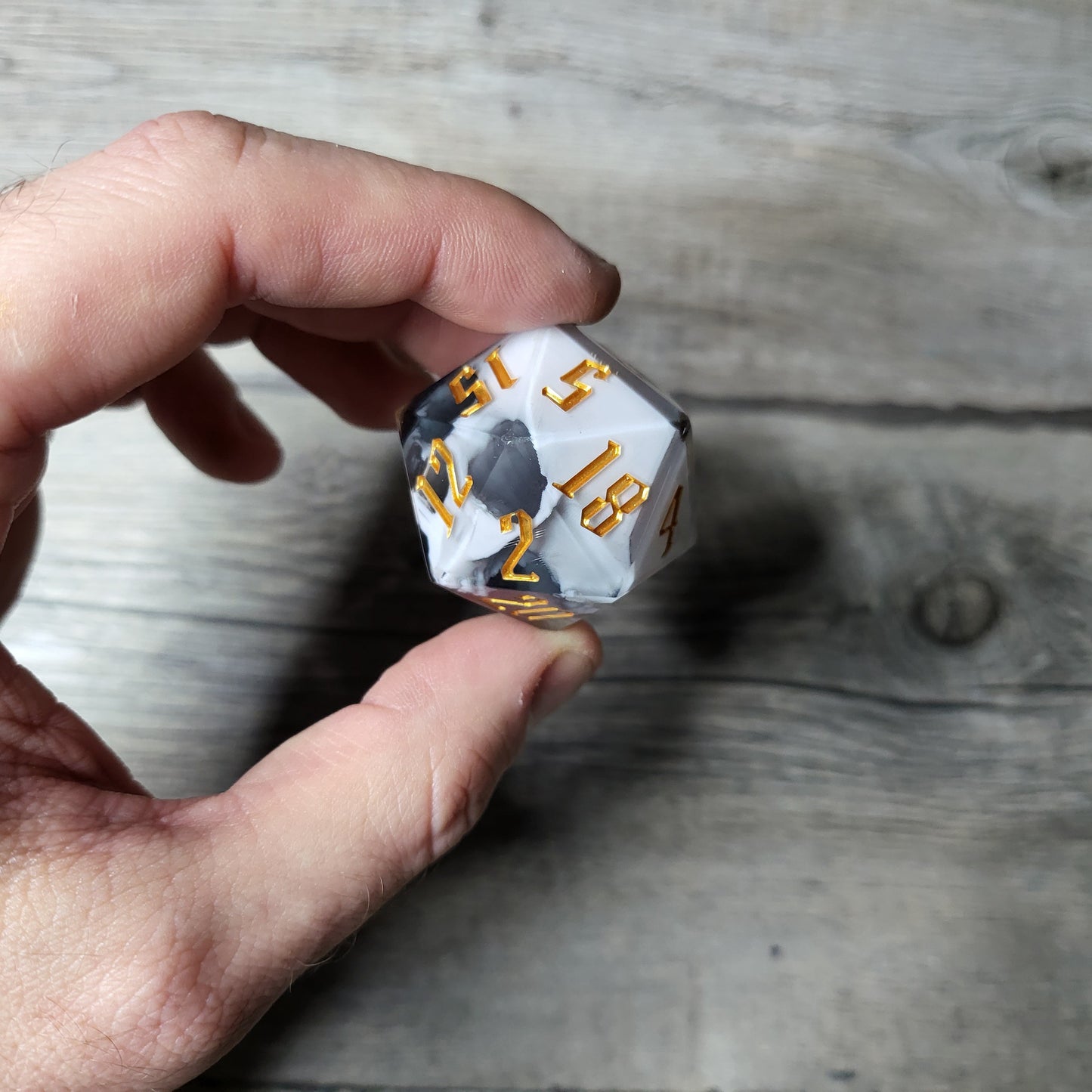 D20 dice in 33 mm format with skull inside for role-playing games for Dungeons and Dragons