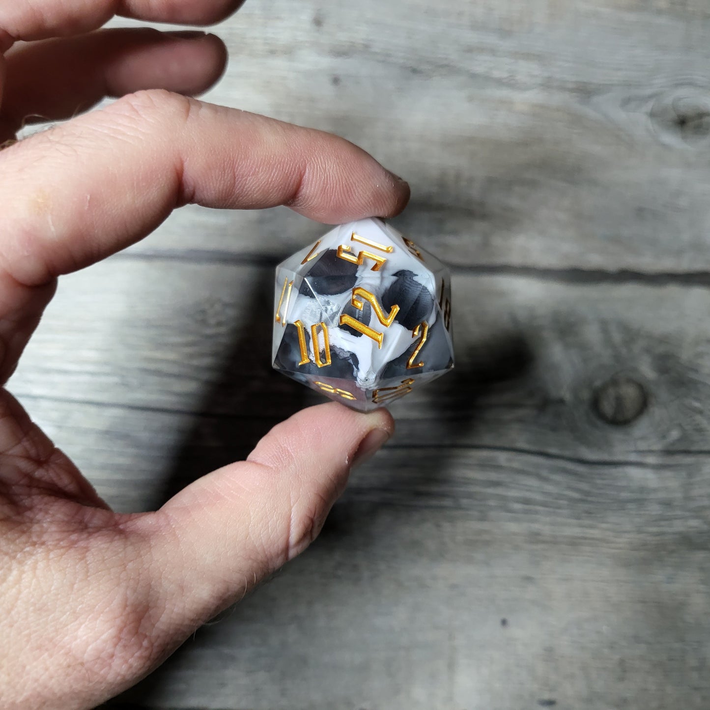 D20 dice in 33 mm format with skull inside for role-playing games for Dungeons and Dragons