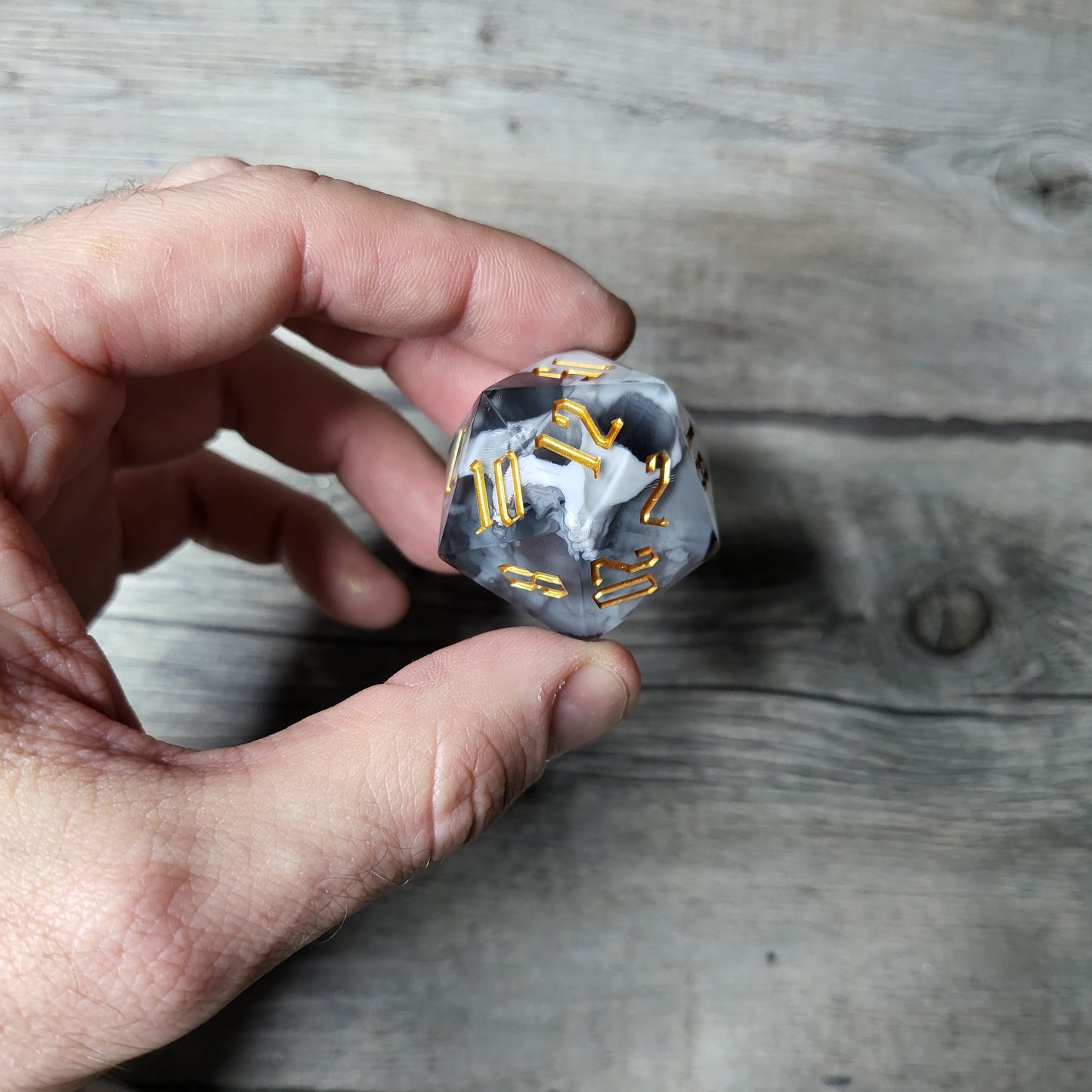 D20 dice in 33 mm format with skull inside for role-playing games for Dungeons and Dragons