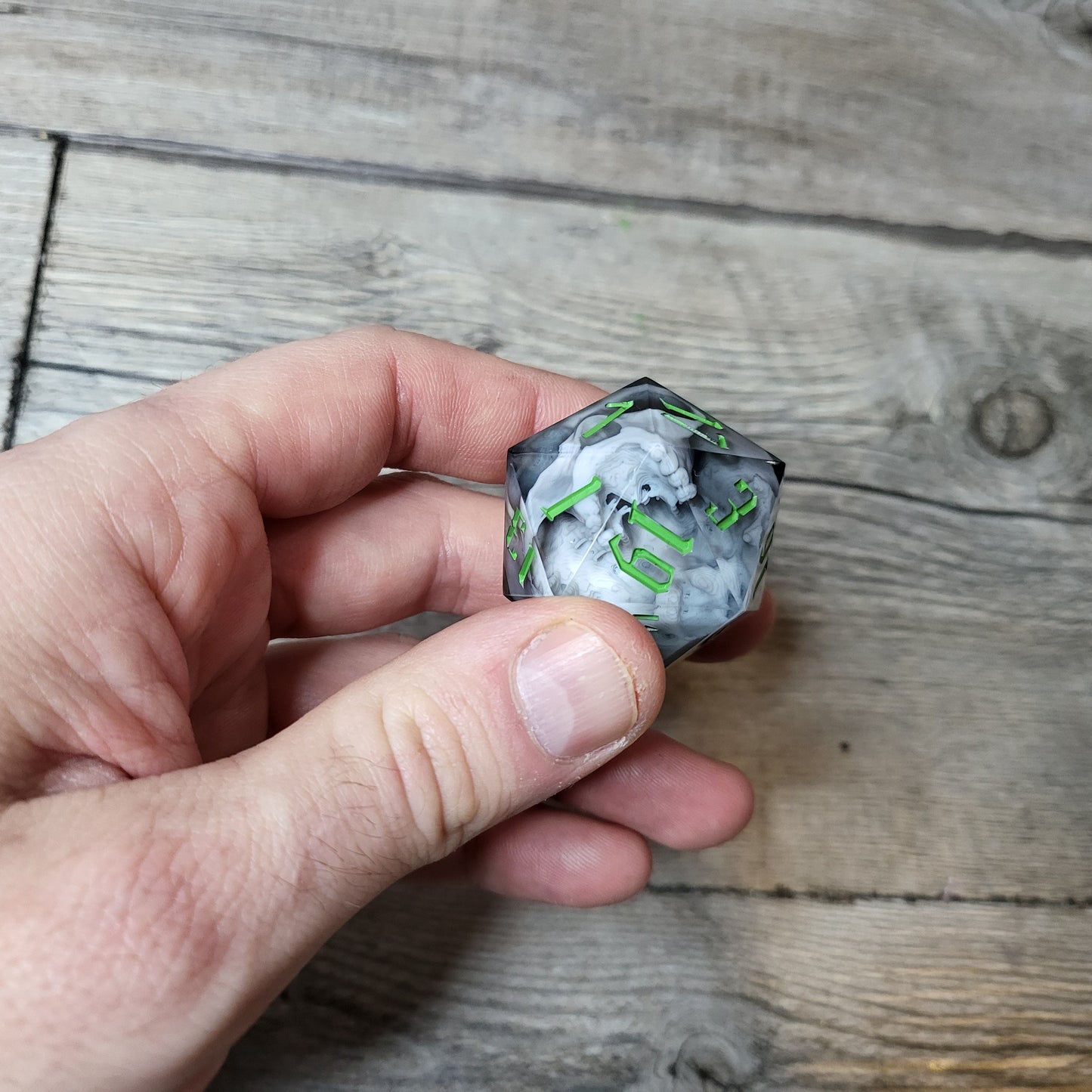 D20 dice in 33 mm format with skull inside for role-playing games for Dungeons and Dragons