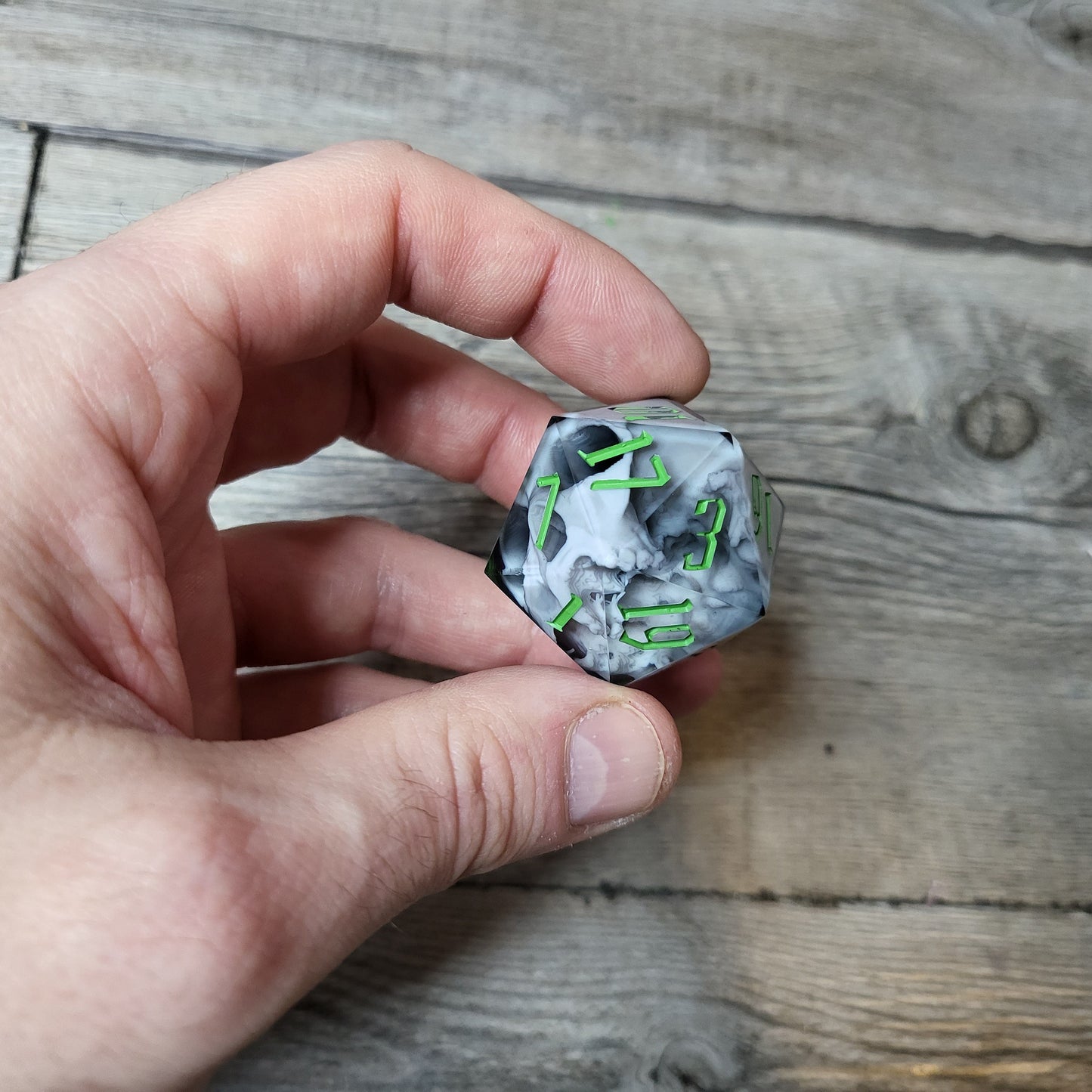 D20 dice in 33 mm format with skull inside for role-playing games for Dungeons and Dragons