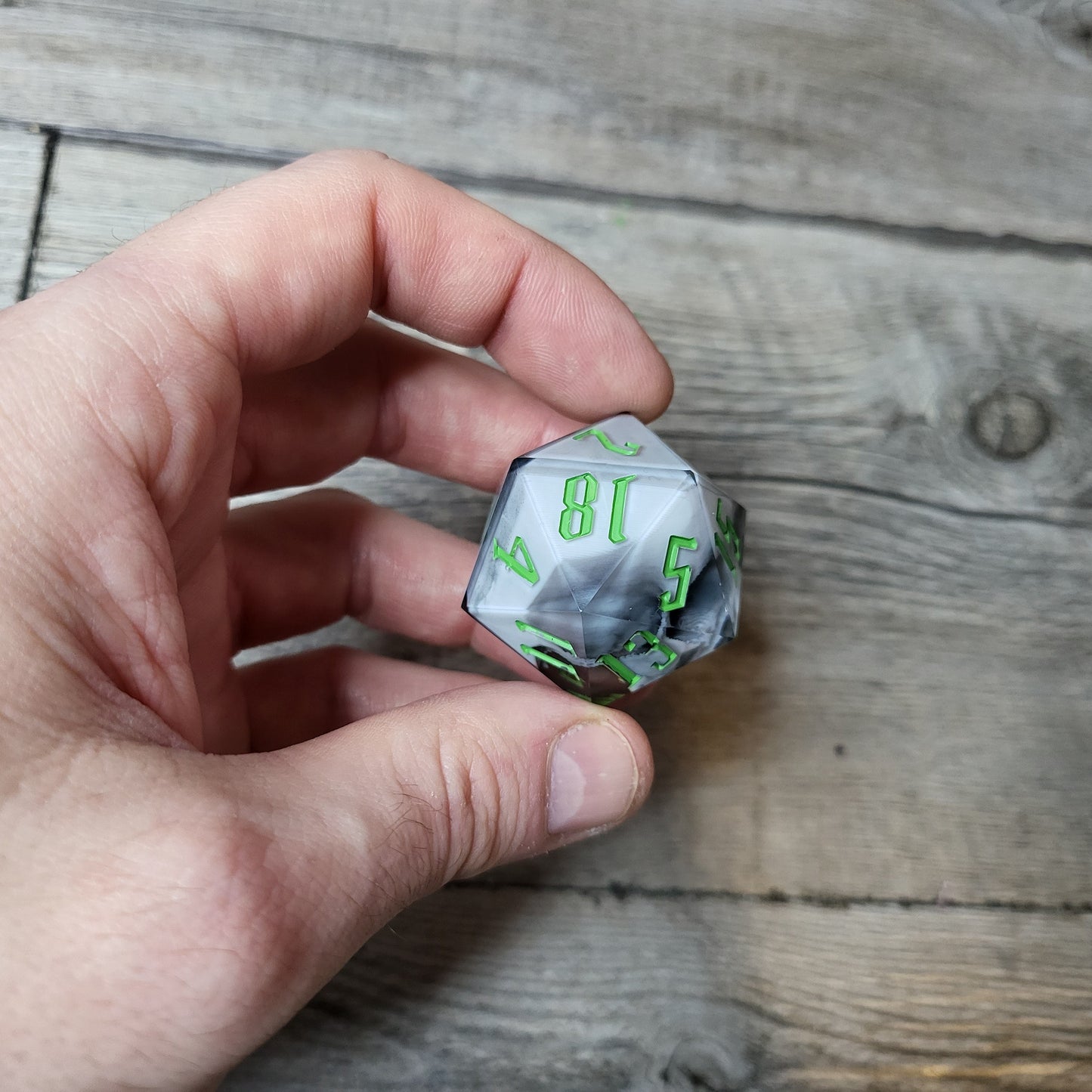 D20 dice in 33 mm format with skull inside for role-playing games for Dungeons and Dragons