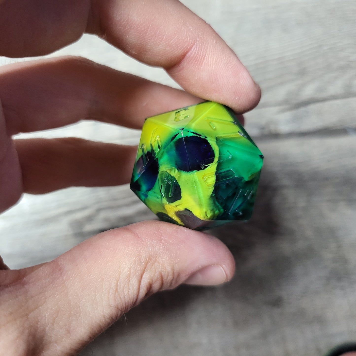 D20 dice in 33 mm format with skull inside for role-playing games for Dungeons and Dragons