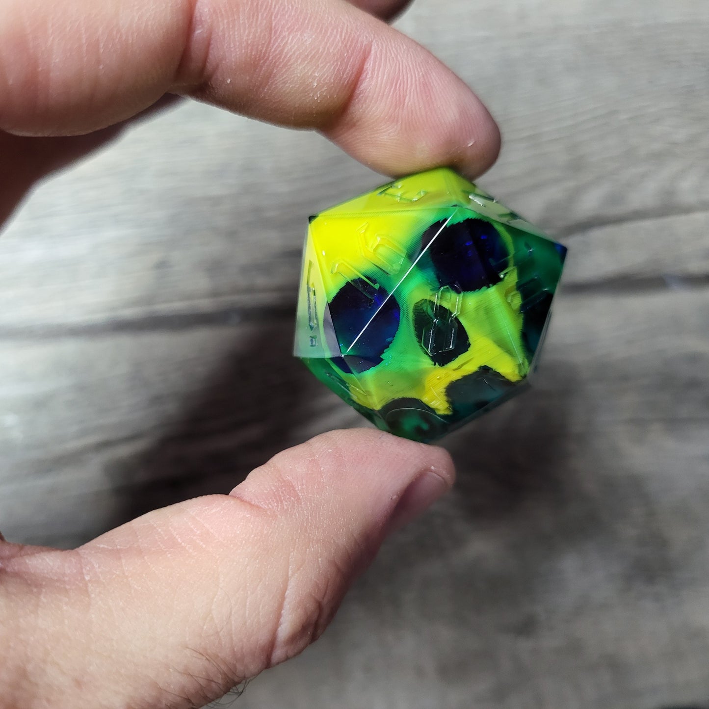 D20 dice in 33 mm format with skull inside for role-playing games for Dungeons and Dragons