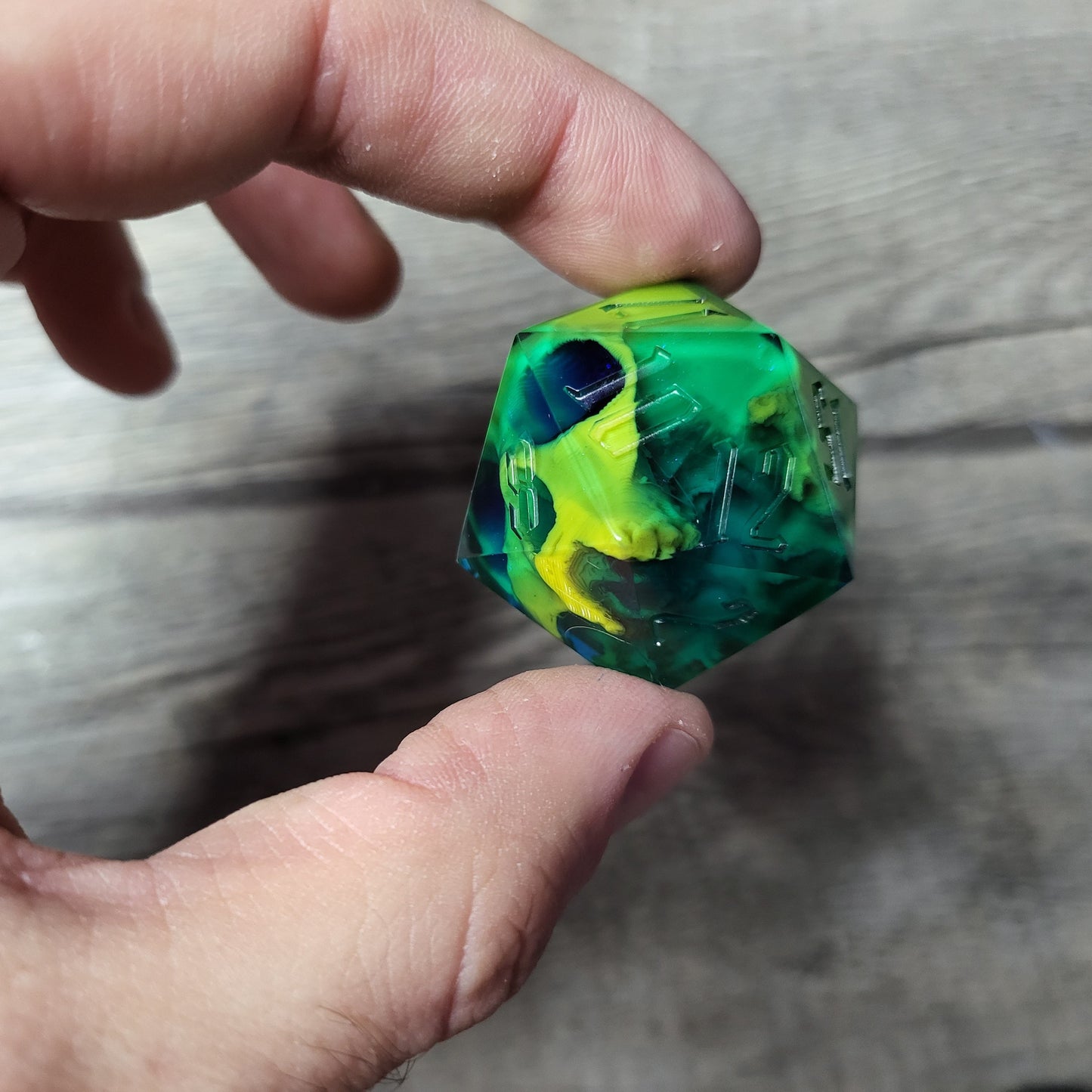 D20 dice in 33 mm format with skull inside for role-playing games for Dungeons and Dragons