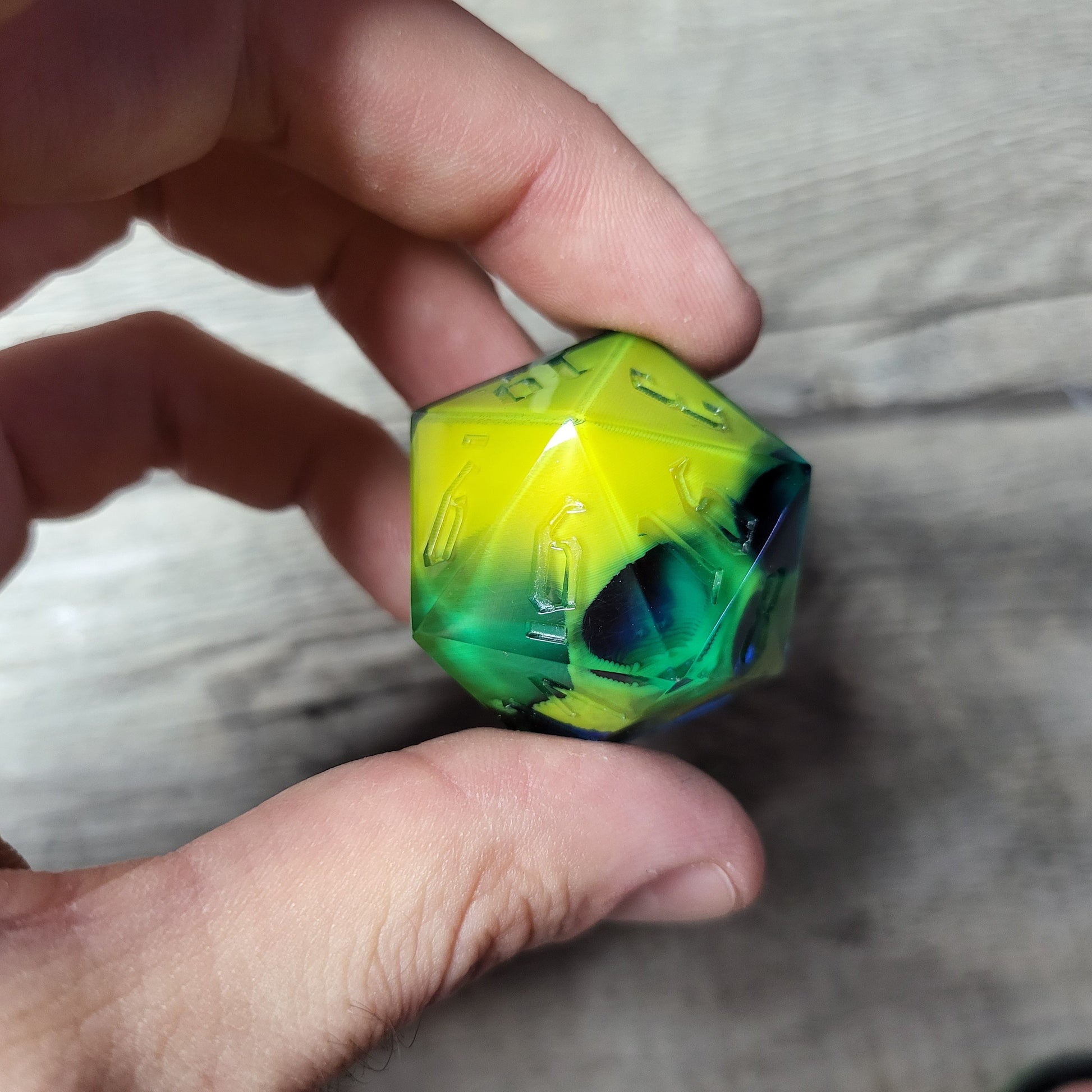 D20 dice in 33 mm format with skull inside for role-playing games for Dungeons and Dragons