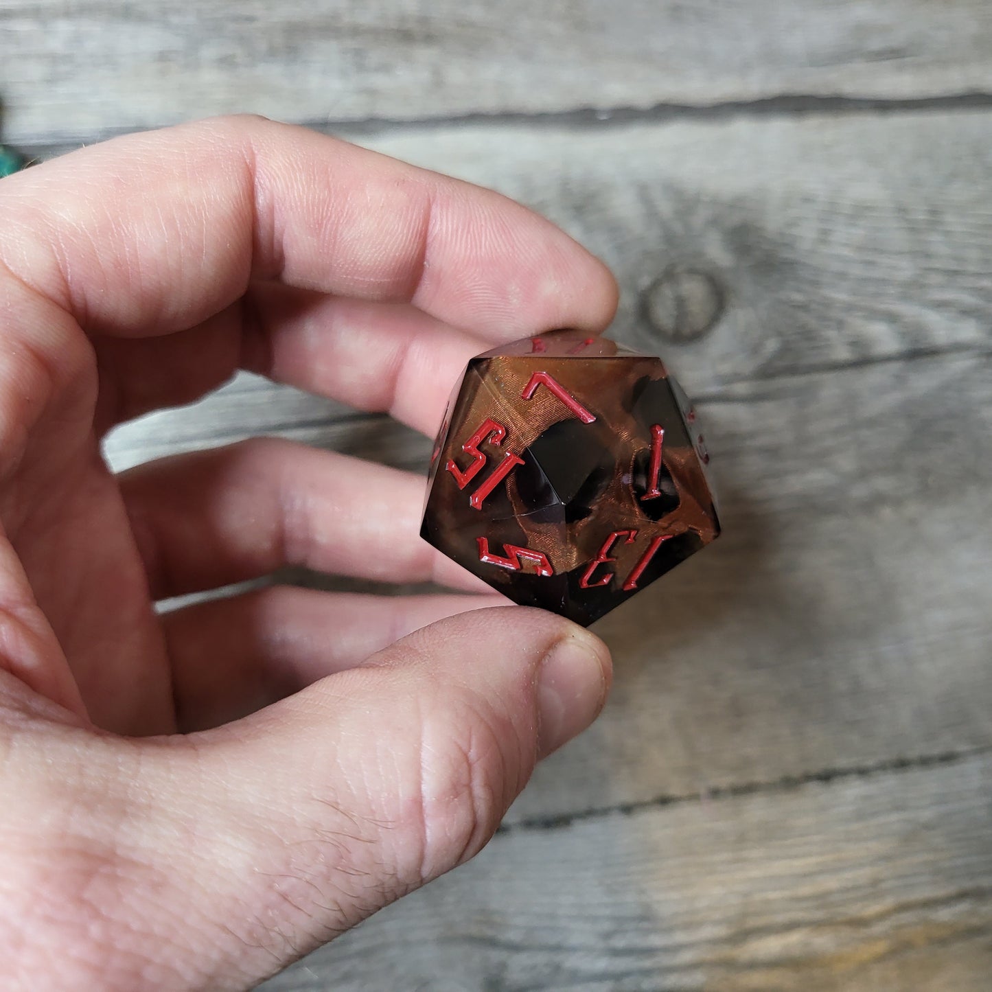 D20 dice in 33 mm format with skull inside for role-playing games for Dungeons and Dragons