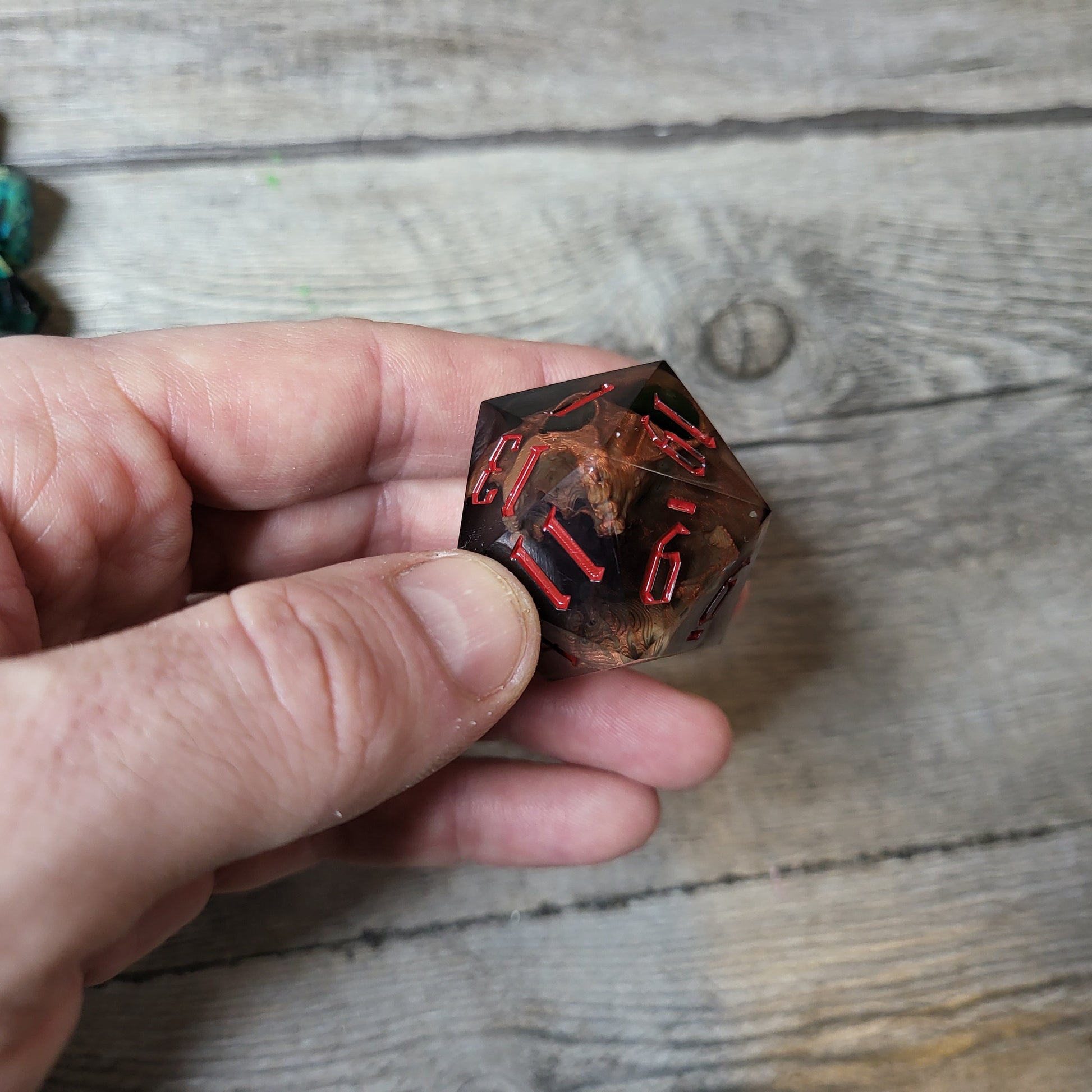 D20 dice in 33 mm format with skull inside for role-playing games for Dungeons and Dragons