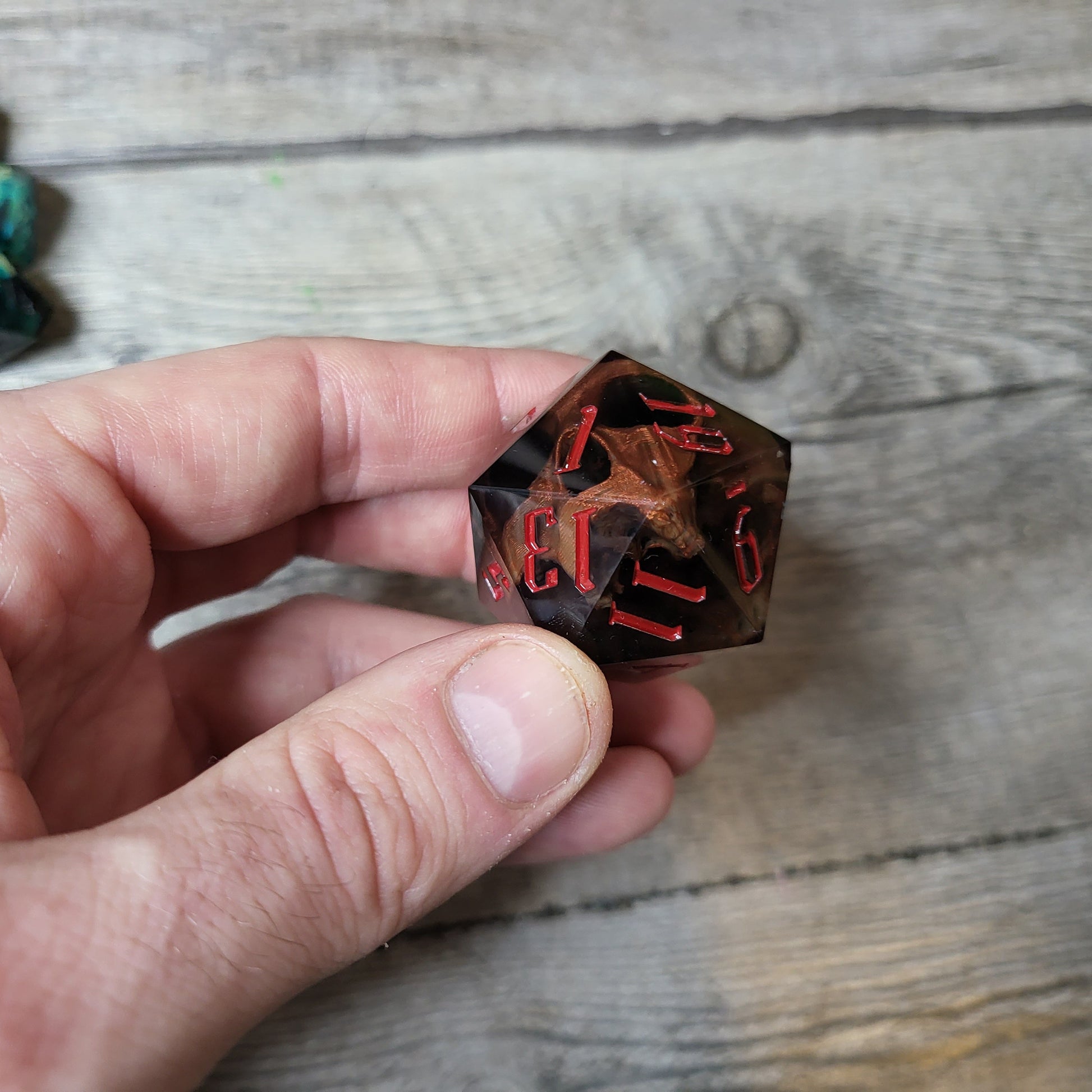 D20 dice in 33 mm format with skull inside for role-playing games for Dungeons and Dragons
