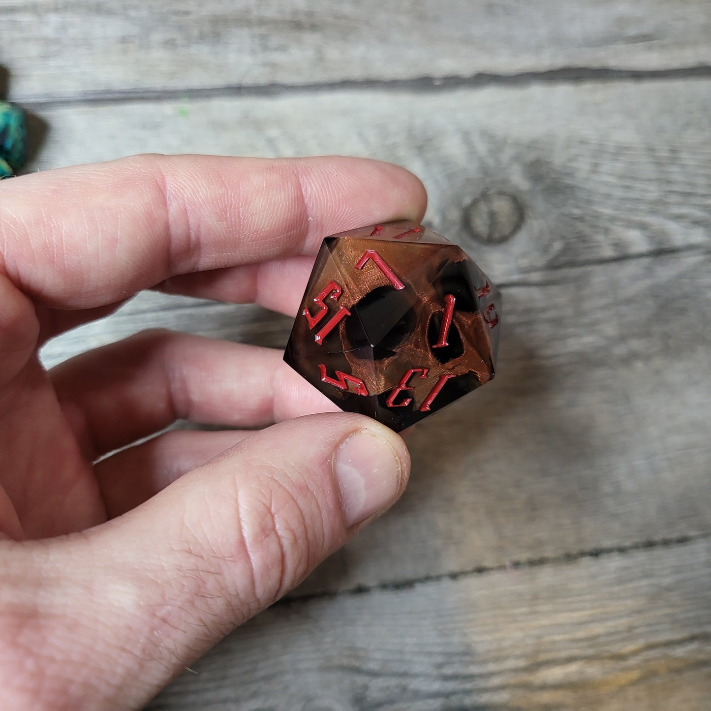 D20 dice in 33 mm format with skull inside for role-playing games for Dungeons and Dragons