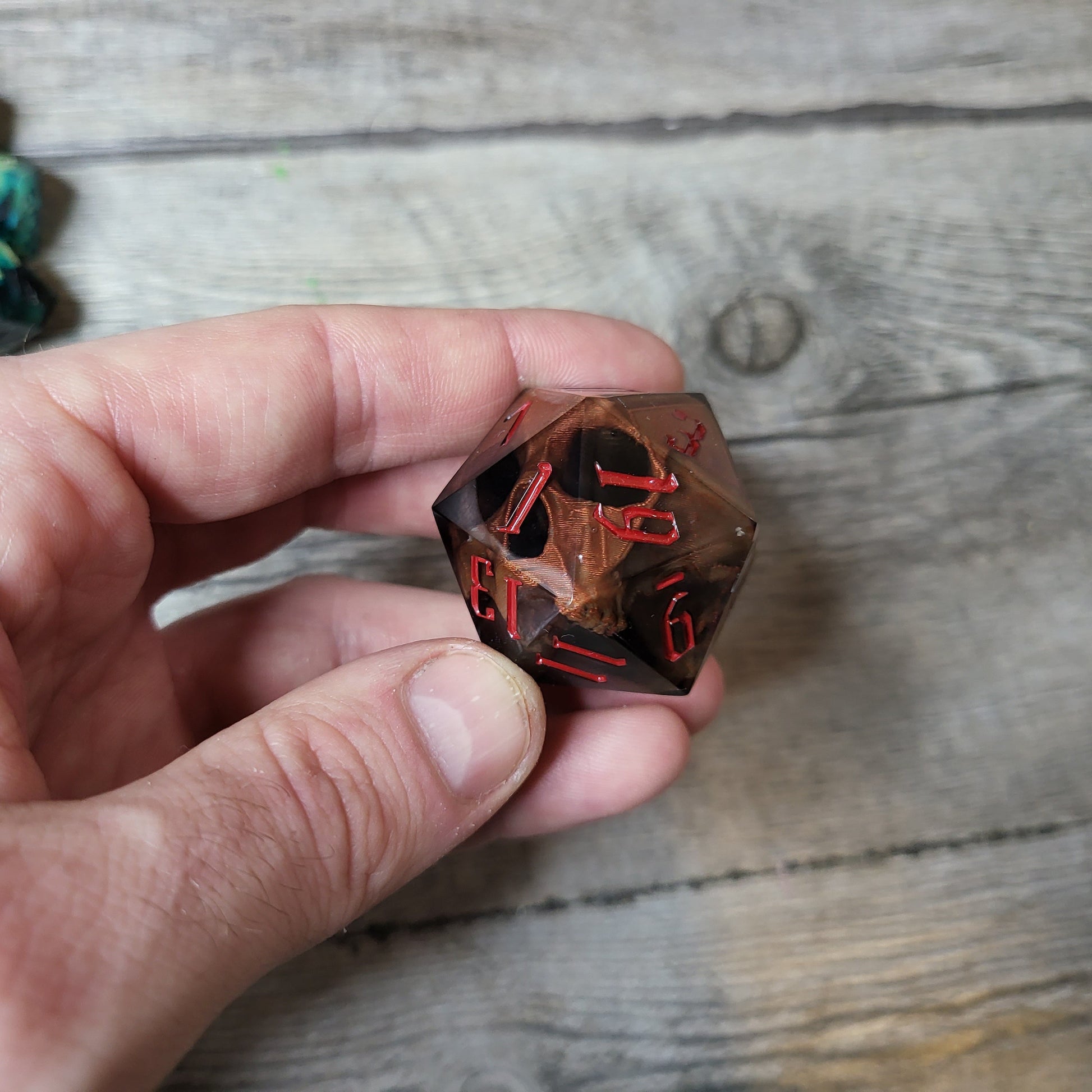D20 dice in 33 mm format with skull inside for role-playing games for Dungeons and Dragons