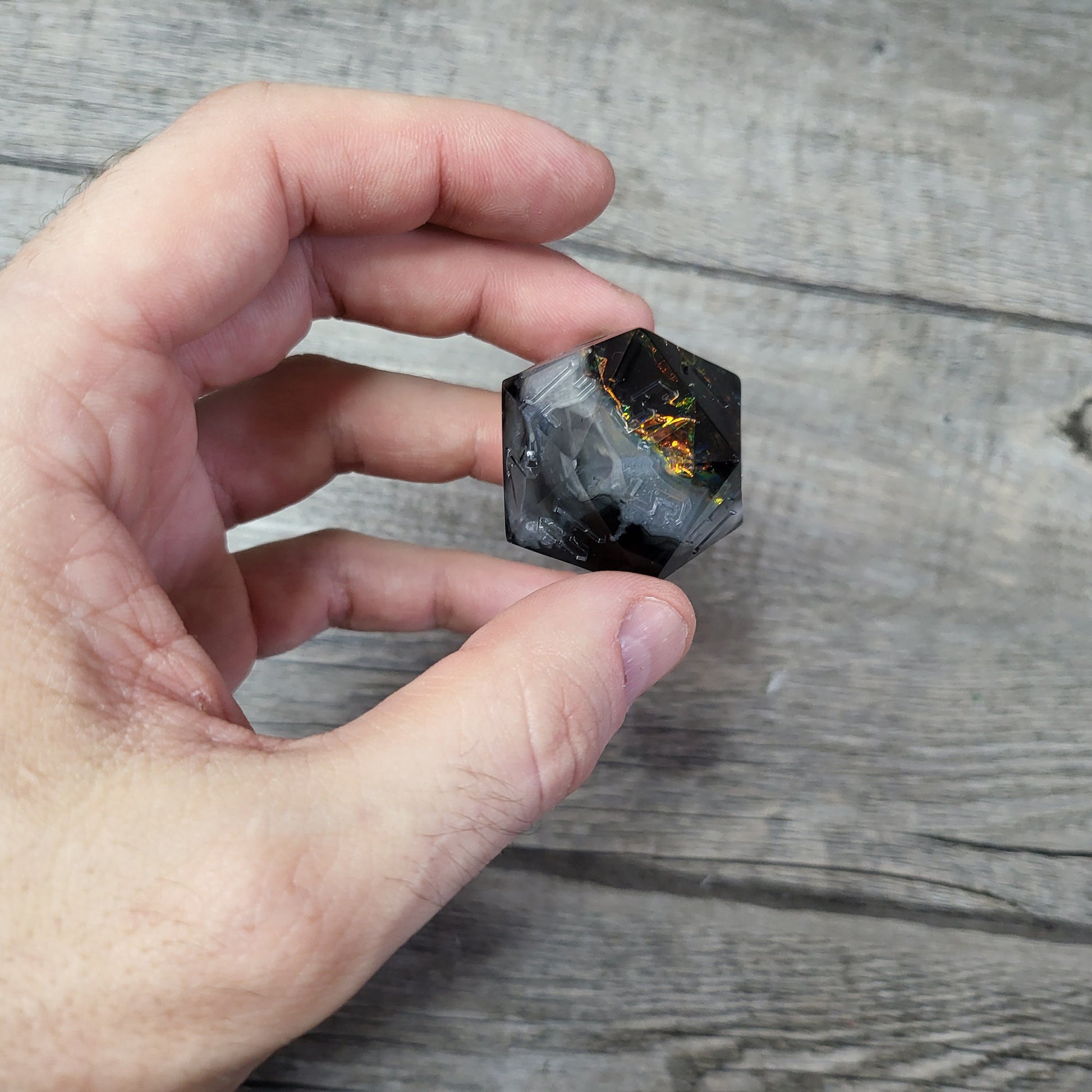 D20 dice in 33 mm format with skull inside for role-playing games for Dungeons and Dragons