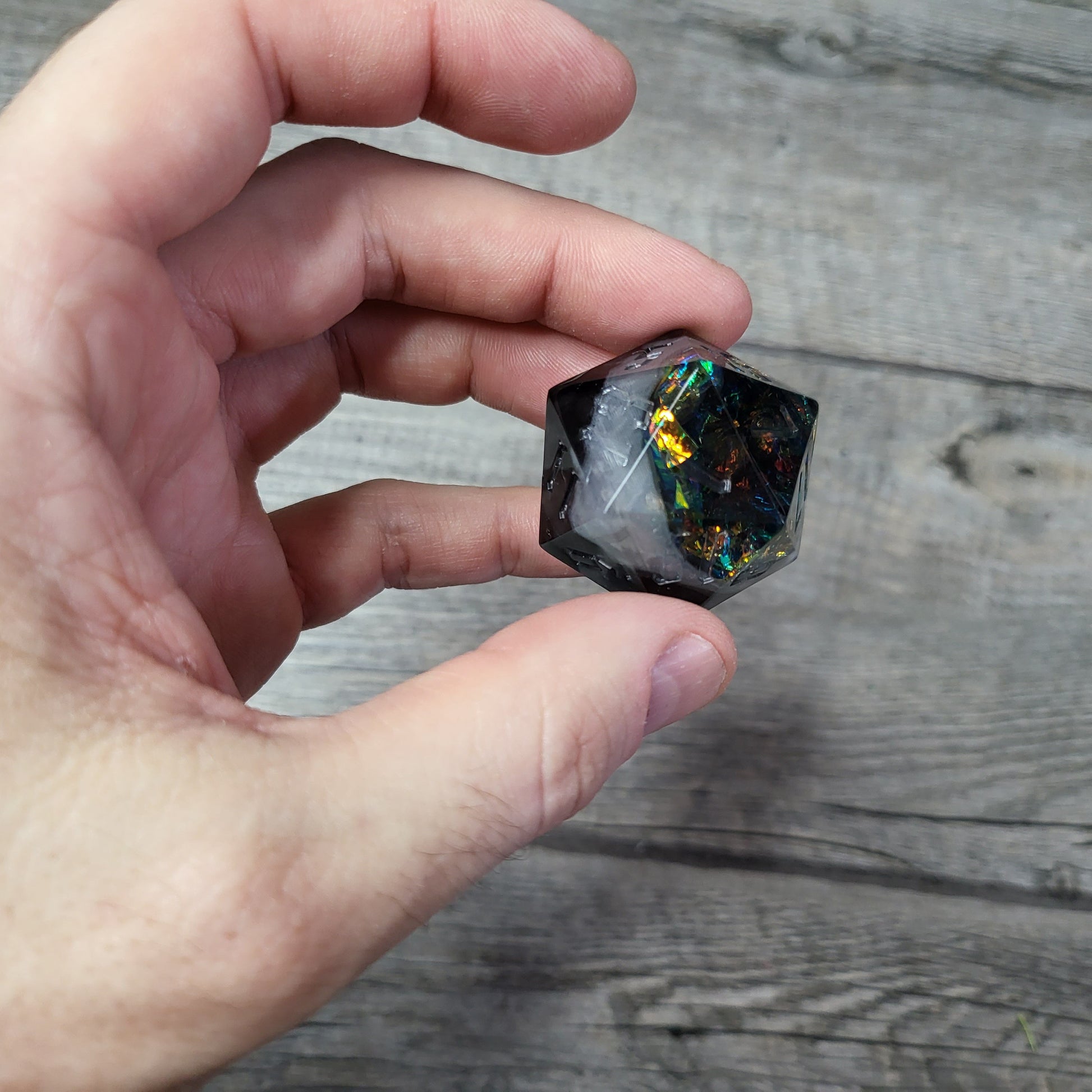 D20 dice in 33 mm format with skull inside for role-playing games for Dungeons and Dragons