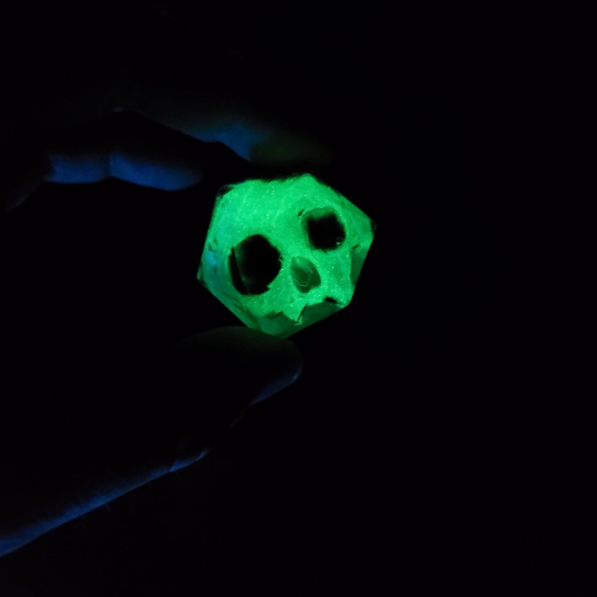 D20 dice in 33 mm format with skull inside for role-playing games for Dungeons and Dragons