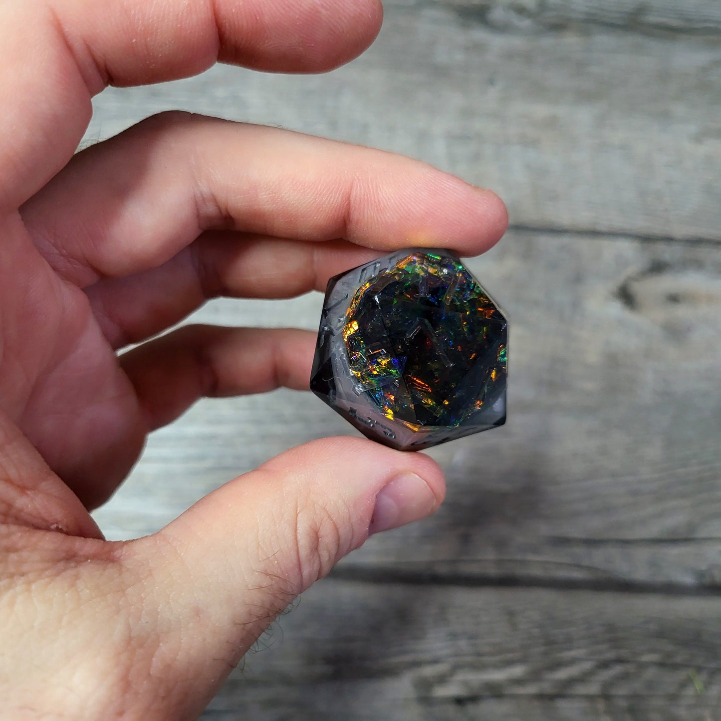 D20 dice in 33 mm format with skull inside for role-playing games for Dungeons and Dragons