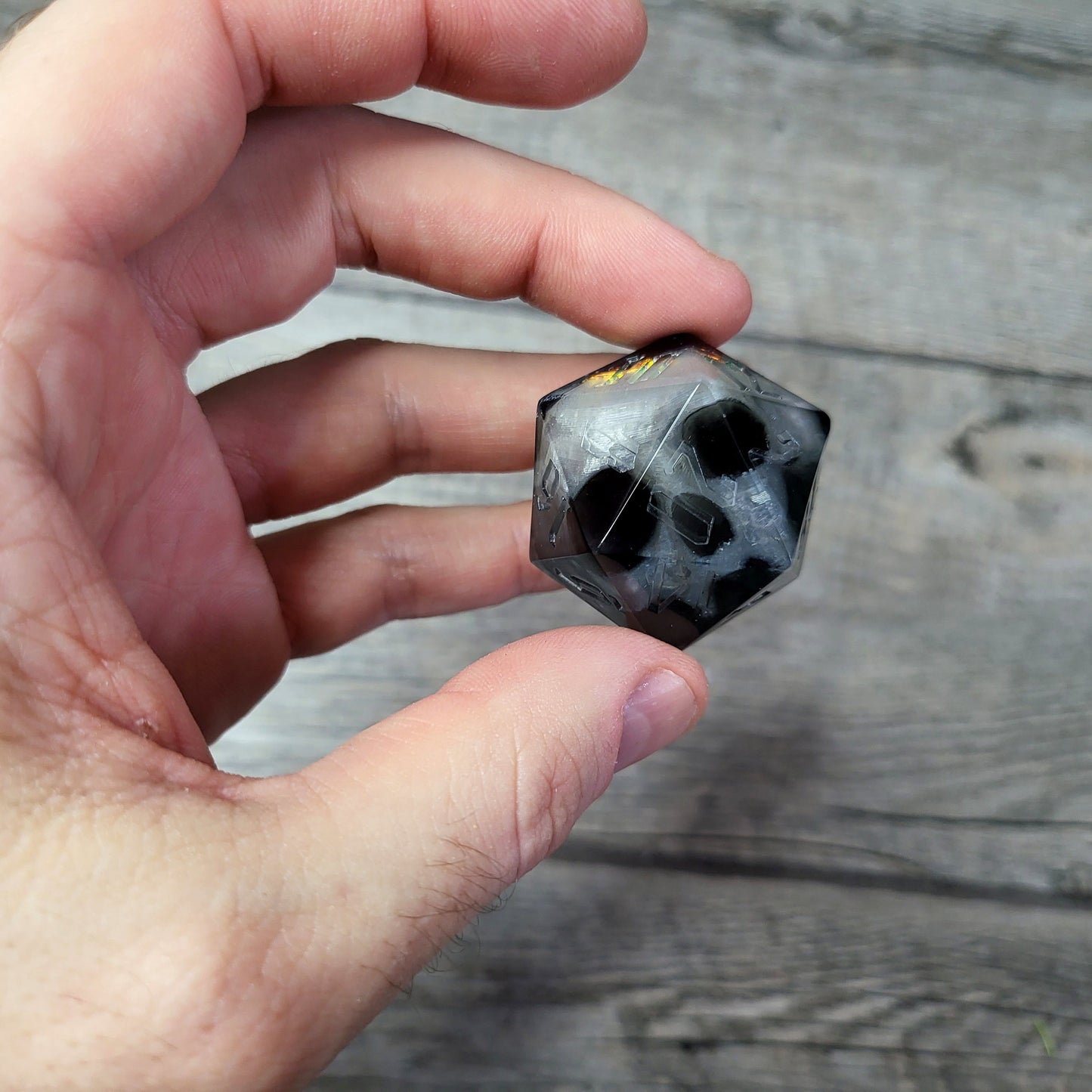 D20 dice in 33 mm format with skull inside for role-playing games for Dungeons and Dragons