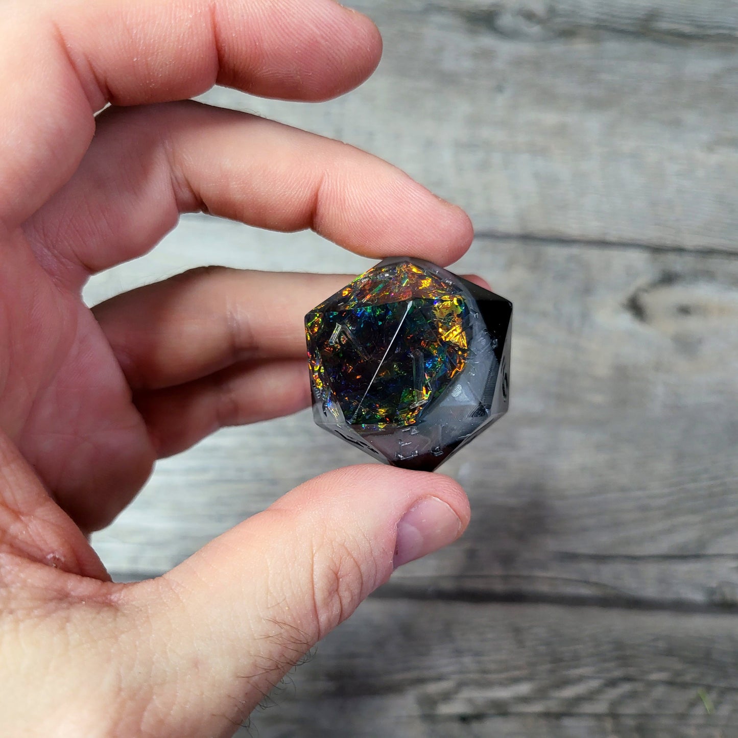 D20 dice in 33 mm format with skull inside for role-playing games for Dungeons and Dragons